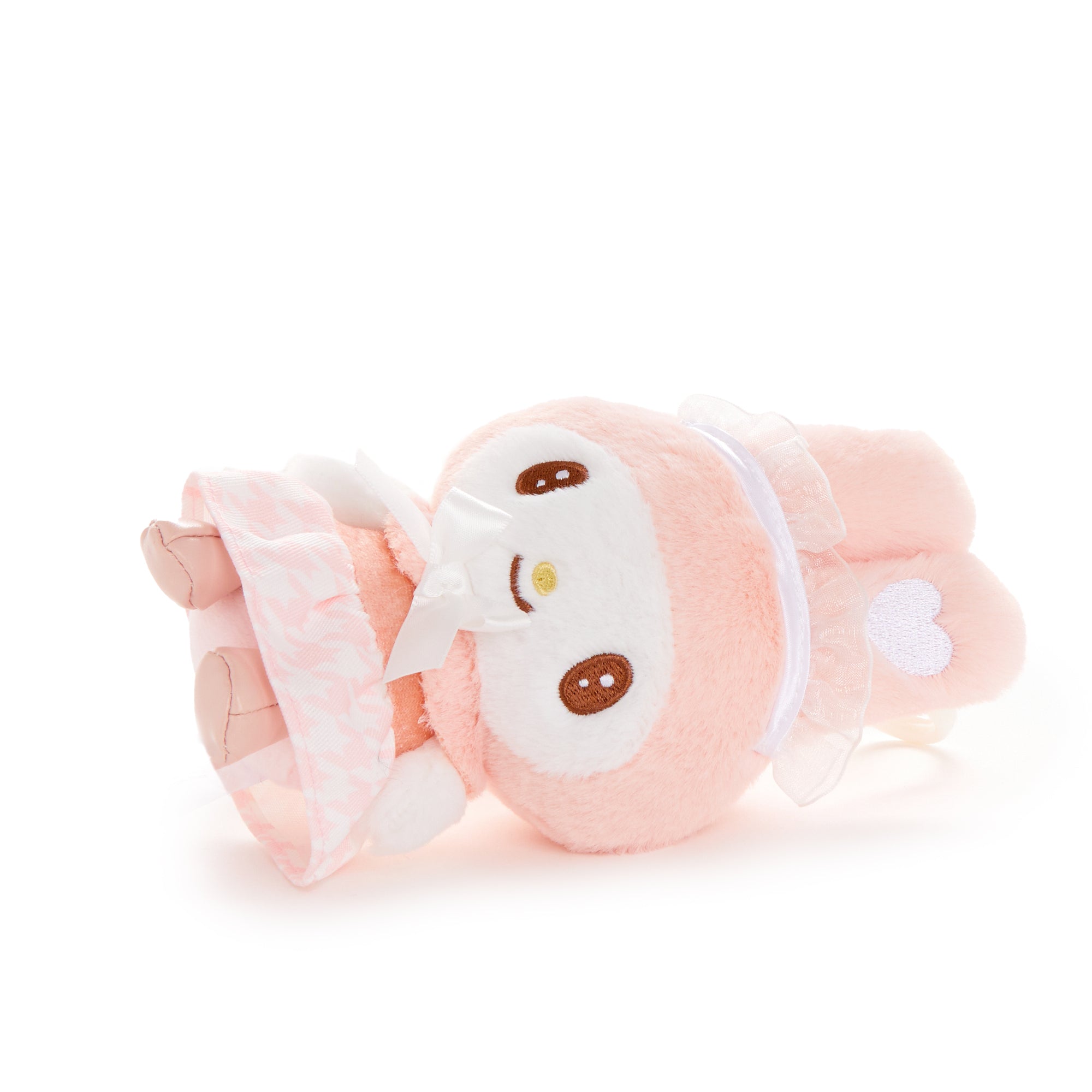 Close-up of My Melody plush charm showing frilly dress and embroidered eyes