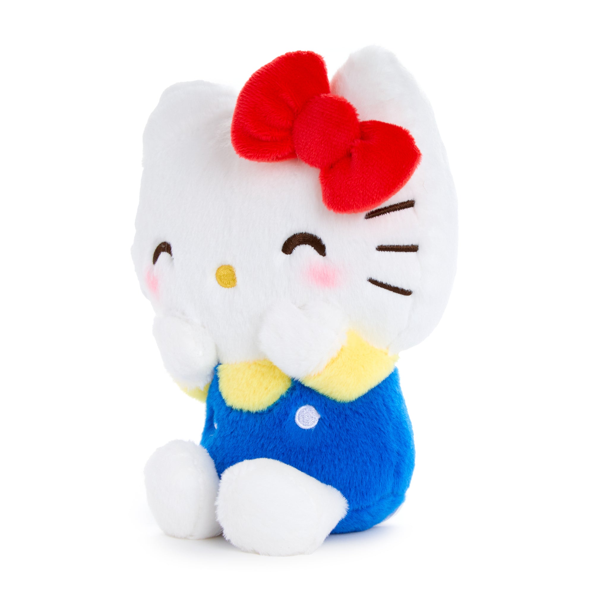 Hello Kitty plush held in hand to show 7-inch scale, ideal for graduation gifts