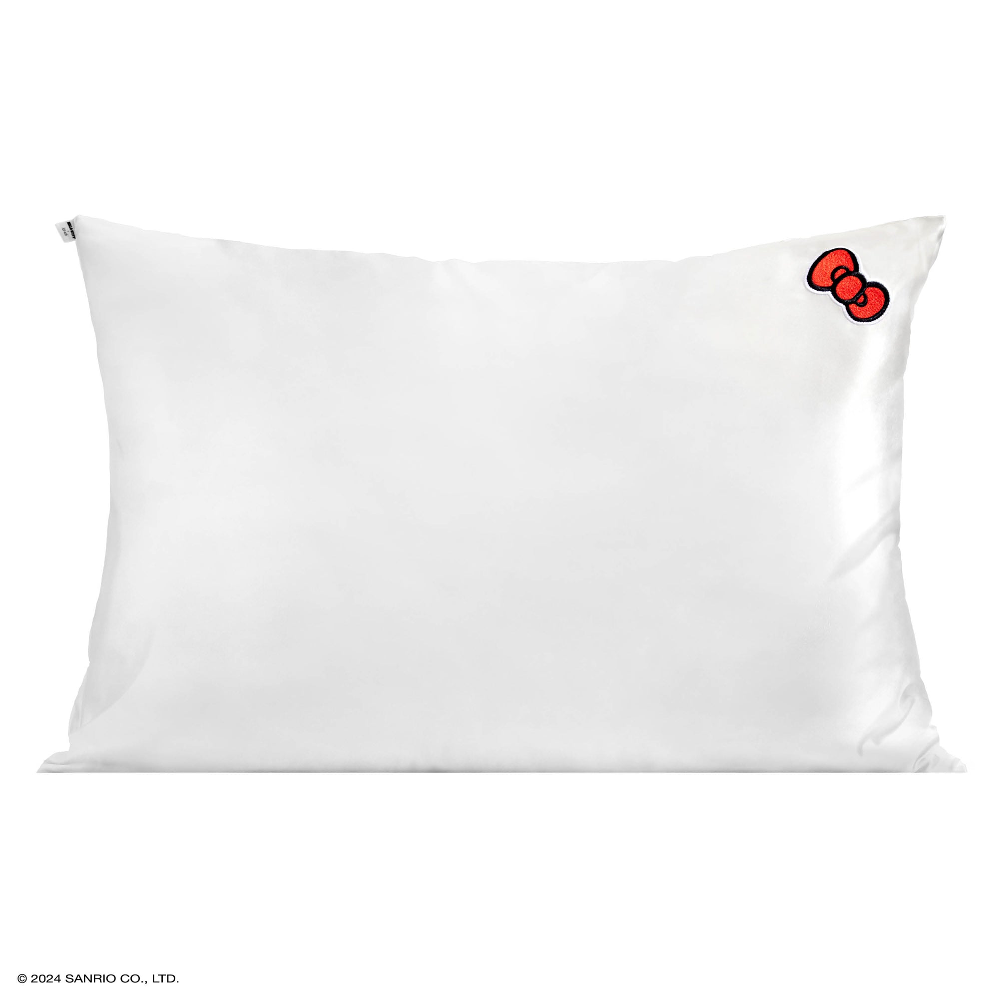 Close-up of the Hello Kitty satin pillowcase showing the red bow detail.