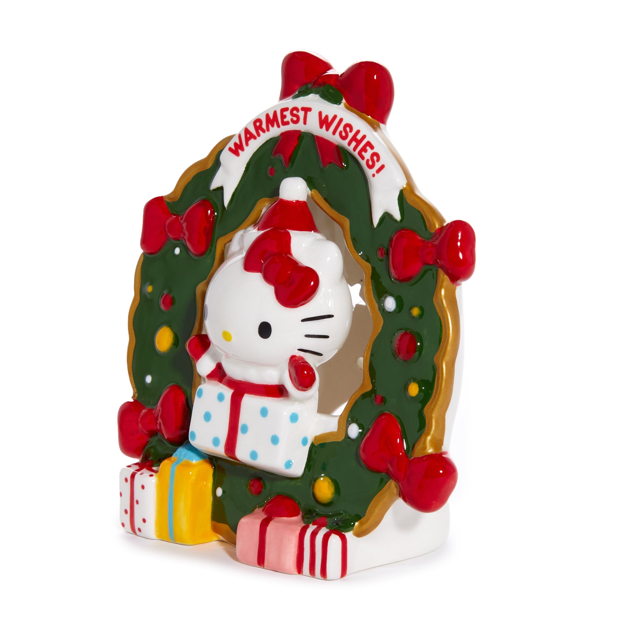 Hello Kitty ceramic tealight holder on a rustic wooden table