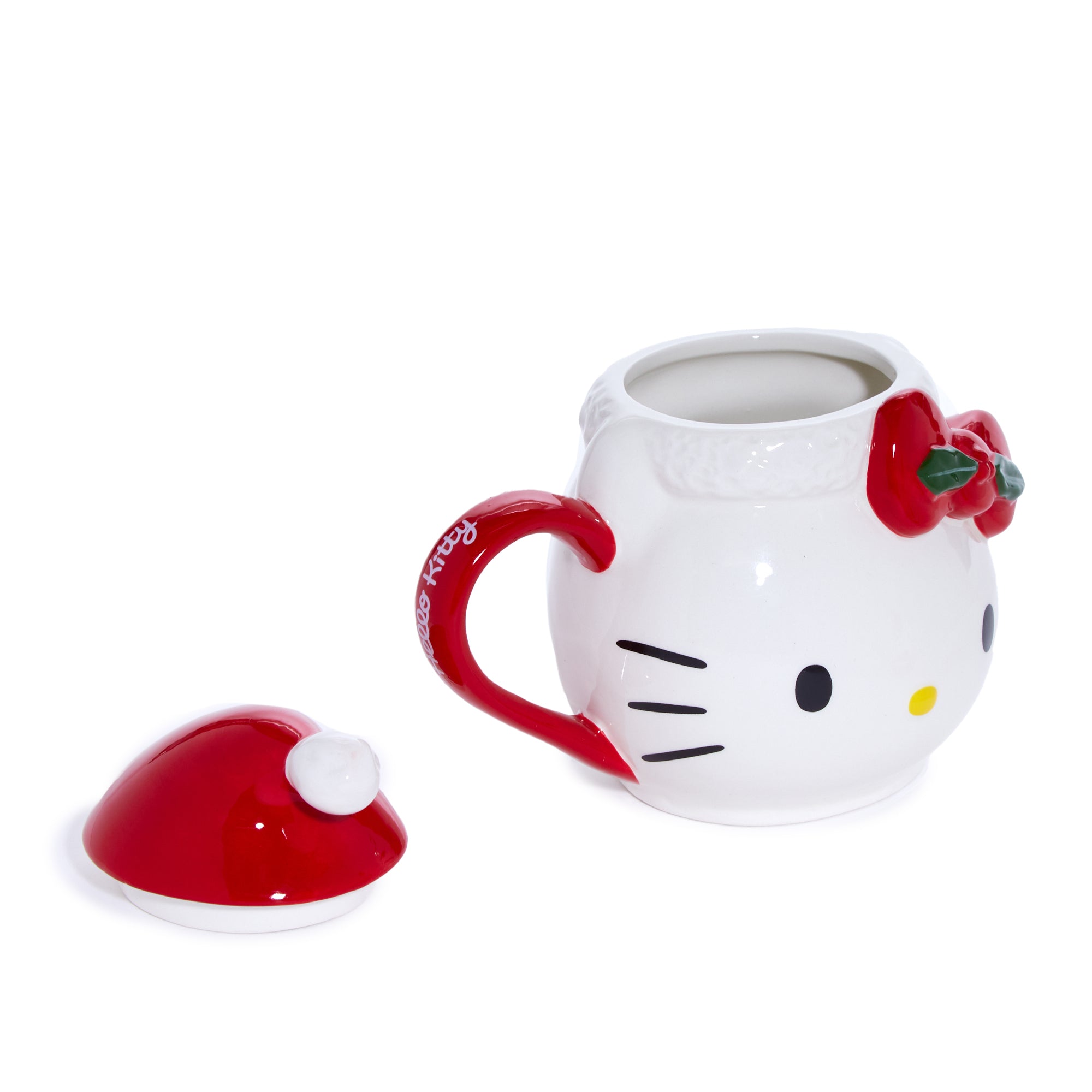 Close-up of Hello Kitty ceramic mug with red Santa bow and cheerful expression