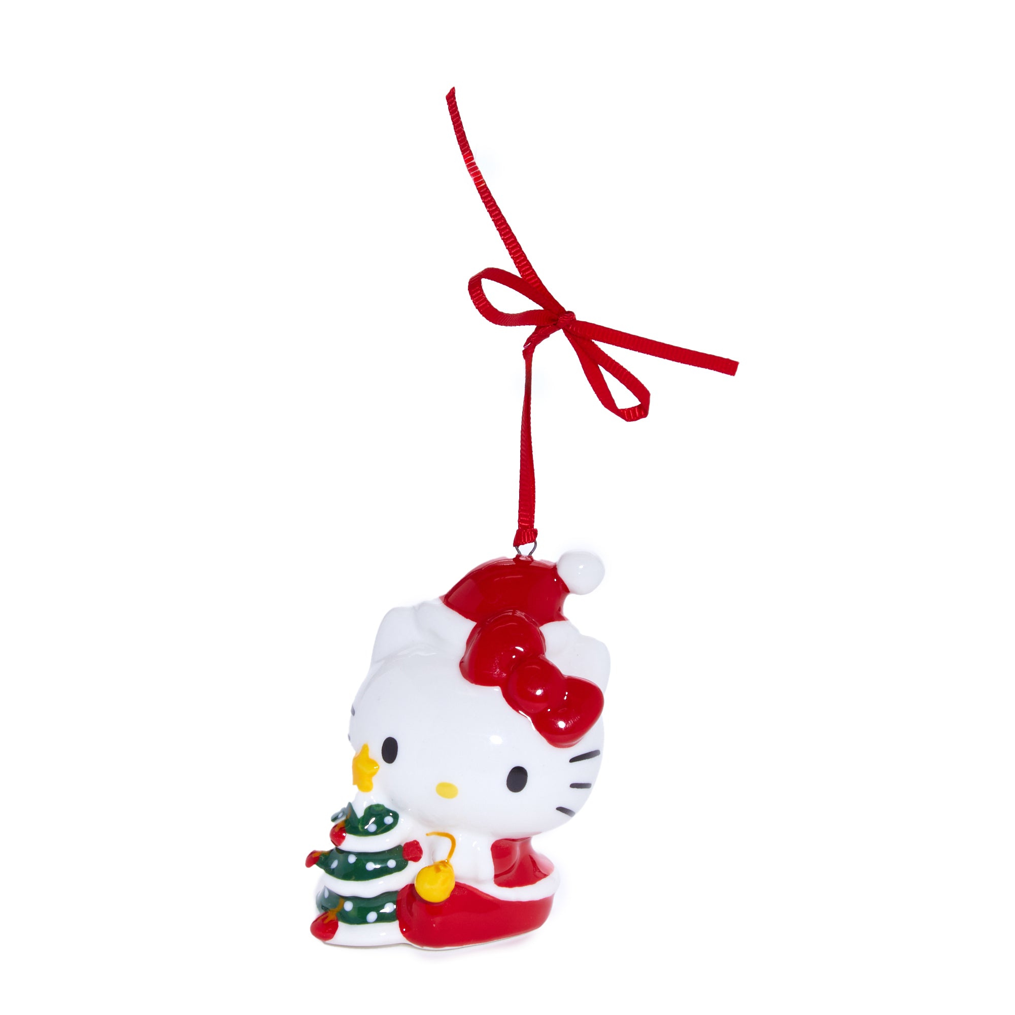 Hand-painted details on figurine face and mug handle highlighted in natural lighting