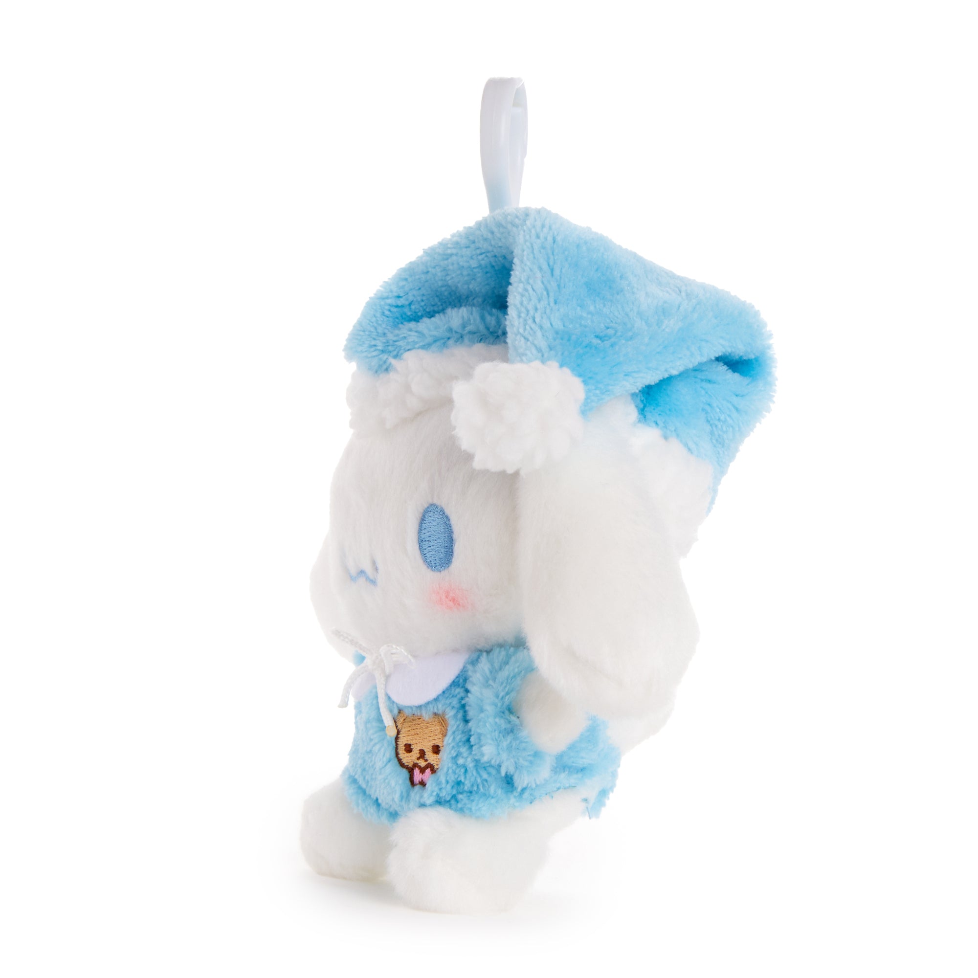 Sanrio mascot clip featuring cinnamoroll in nightcap, hanging from a purse