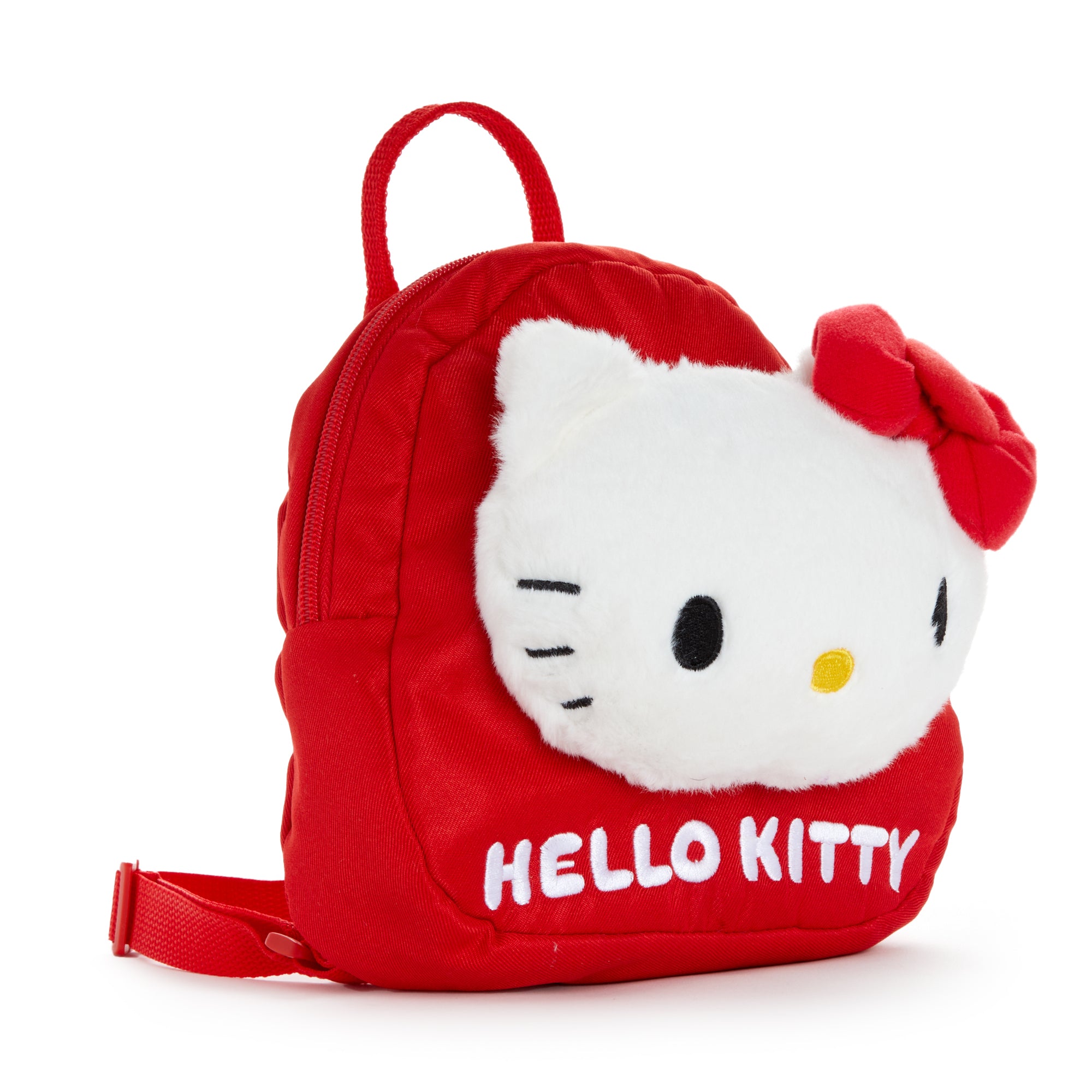 Hello Kitty mini backpack displayed on a wooden table with school supplies