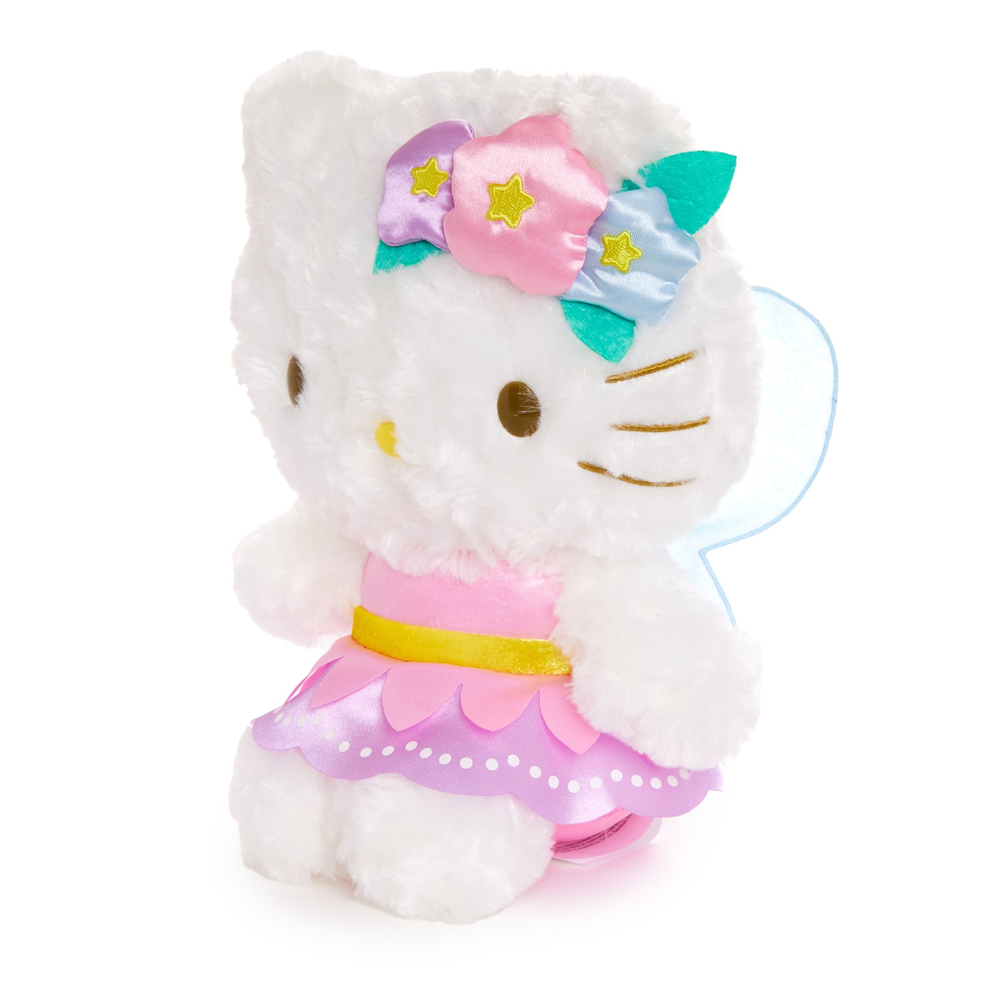 Hello Kitty plush toy lying among spring blossoms as a cheerful collectible