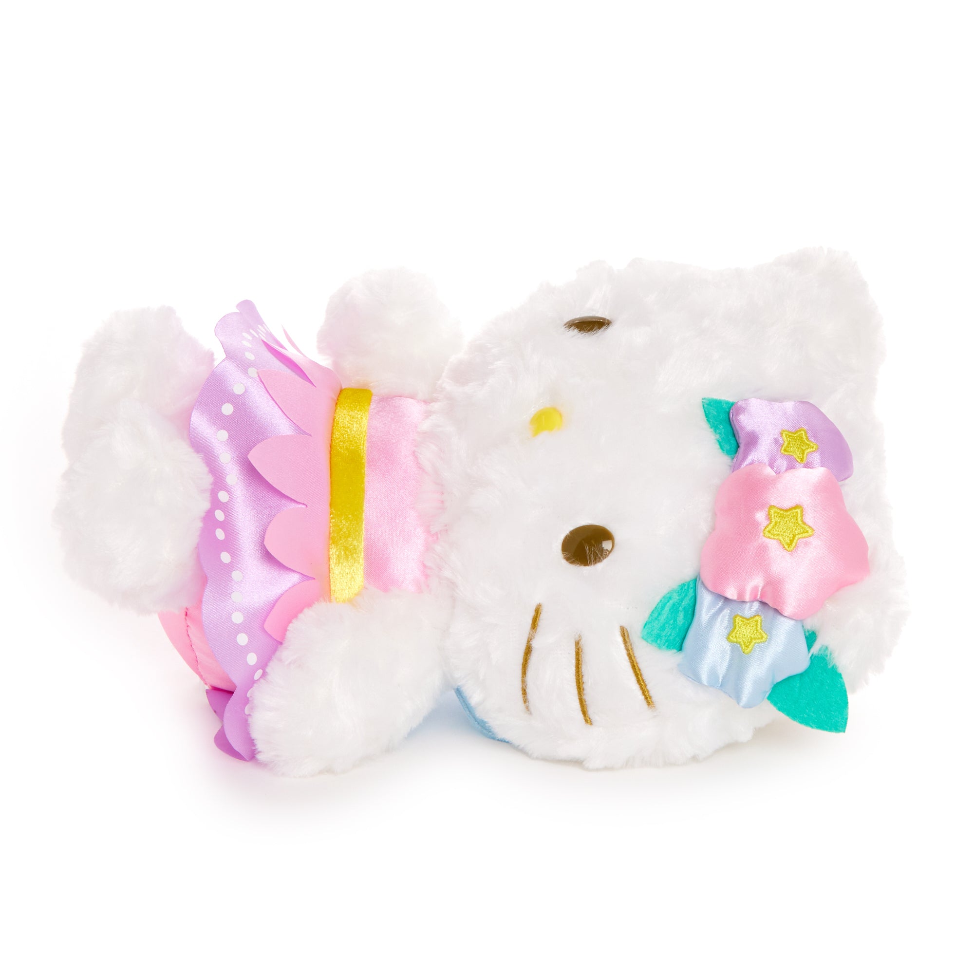 Hello Kitty plush toy lying among spring blossoms as a cheerful collectible