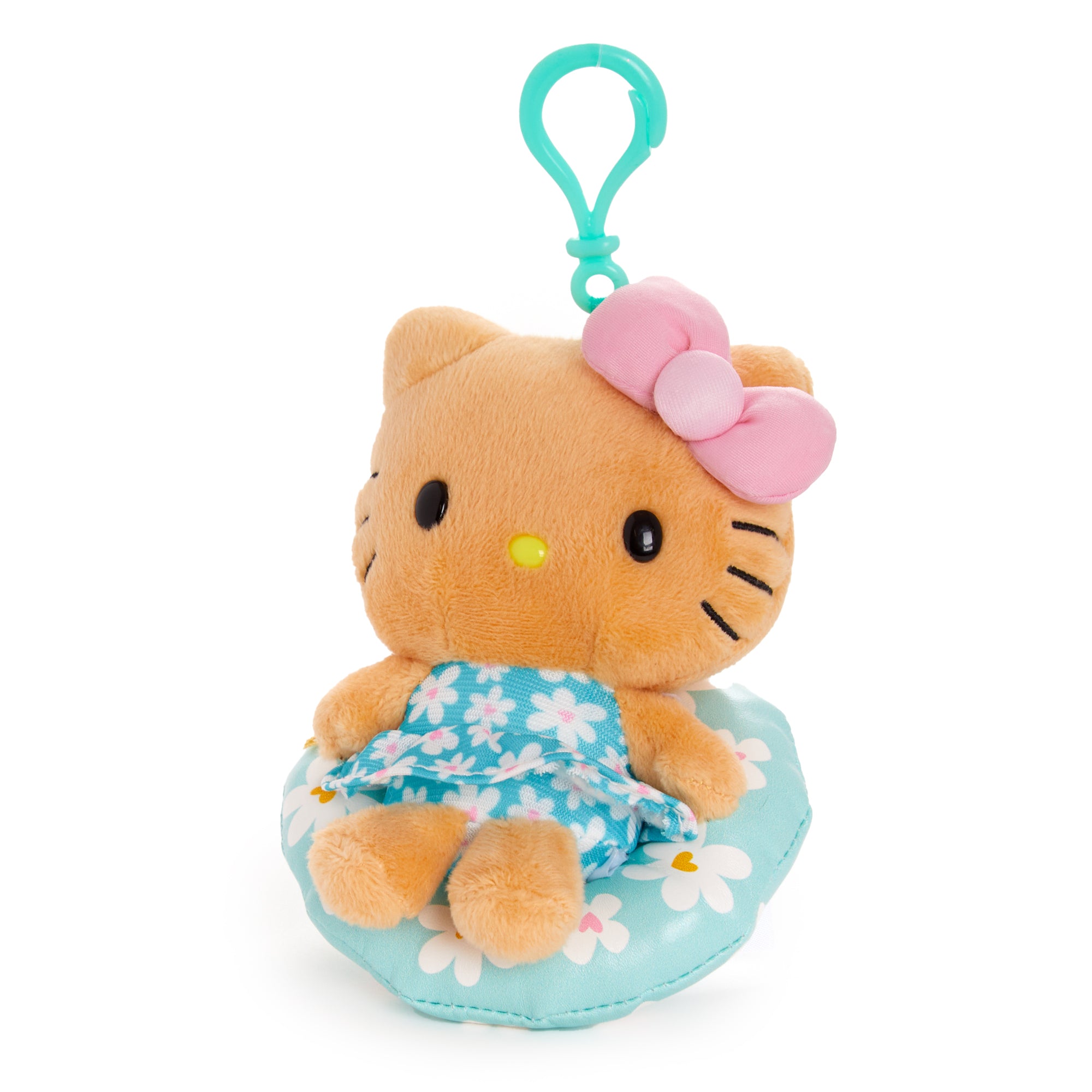 Tanned Hello Kitty plush clip shown attached to a backpack for poolside use