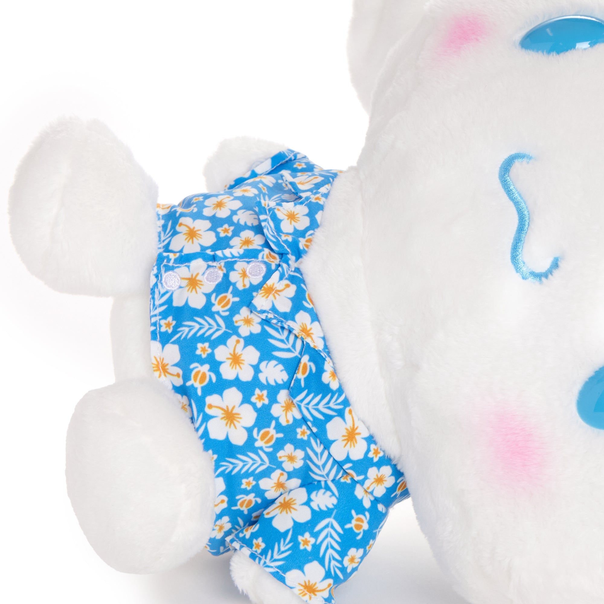 Close-up of Sanrio Cinnamoroll plush toy showing embroidered floral details