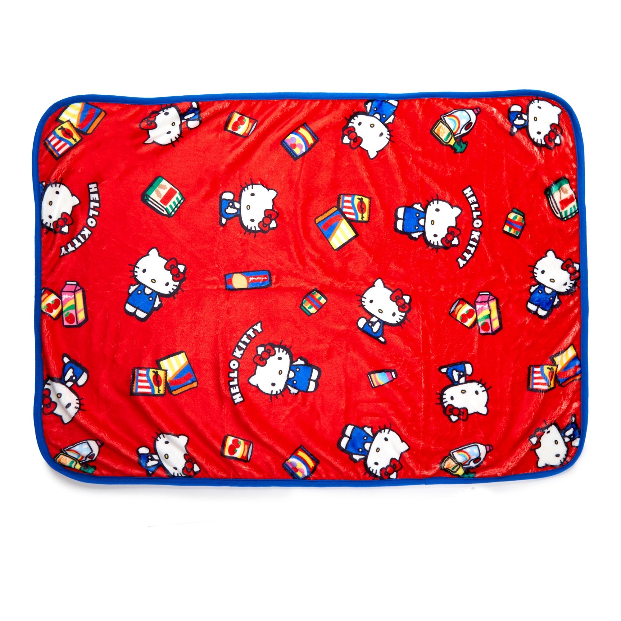 Hello Kitty throw blanket with vibrant supermarket-themed design on a sofa.