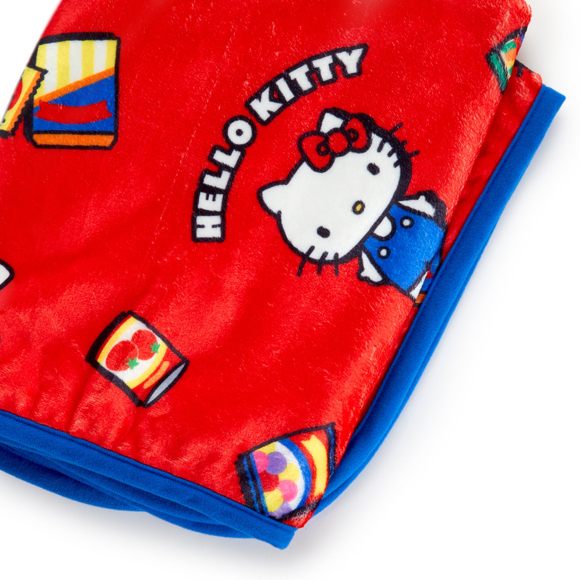 Cozy throw blanket featuring Hello Kitty, perfect for snuggling during grocery trips.