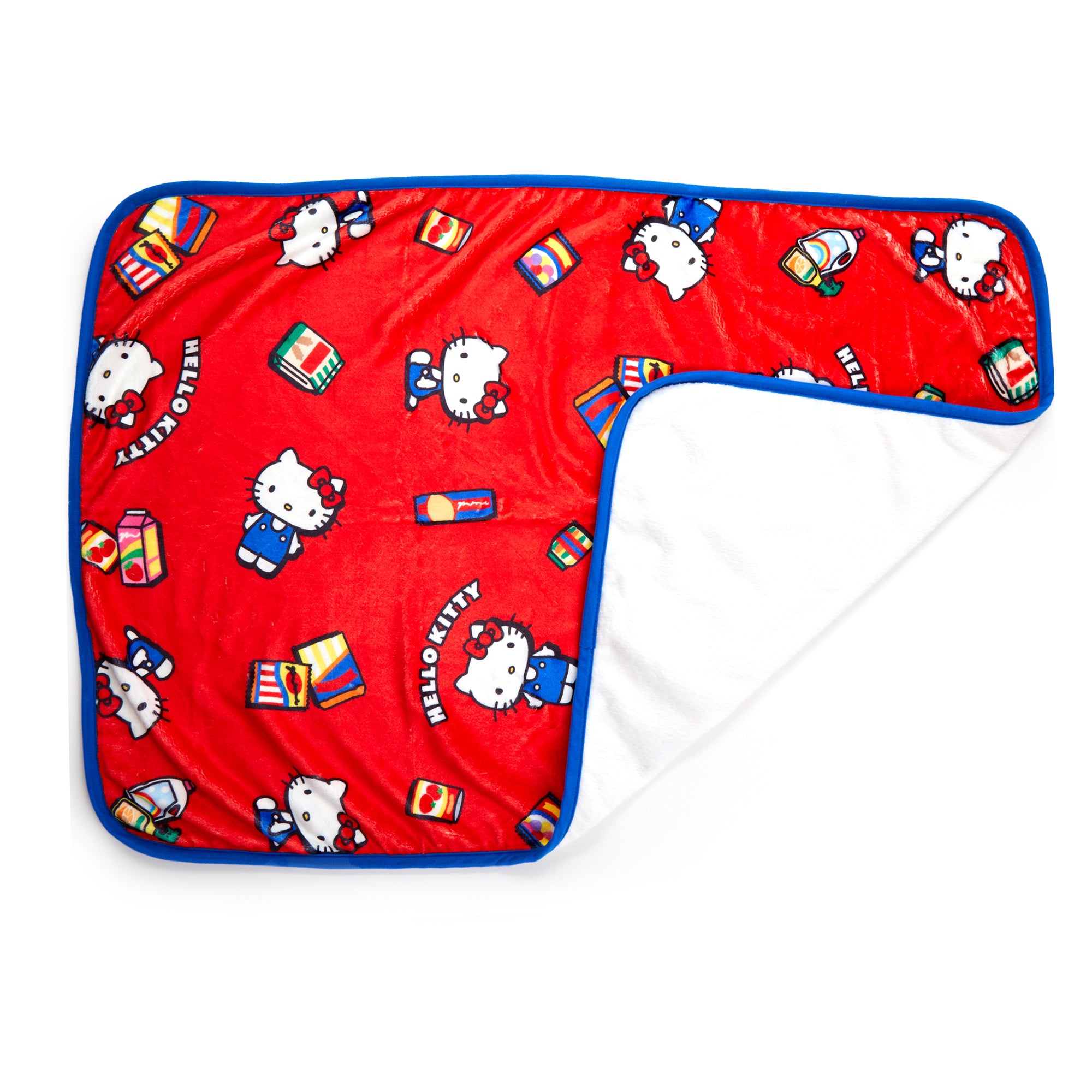 Hello Kitty throw blanket with vibrant supermarket-themed design on a sofa.