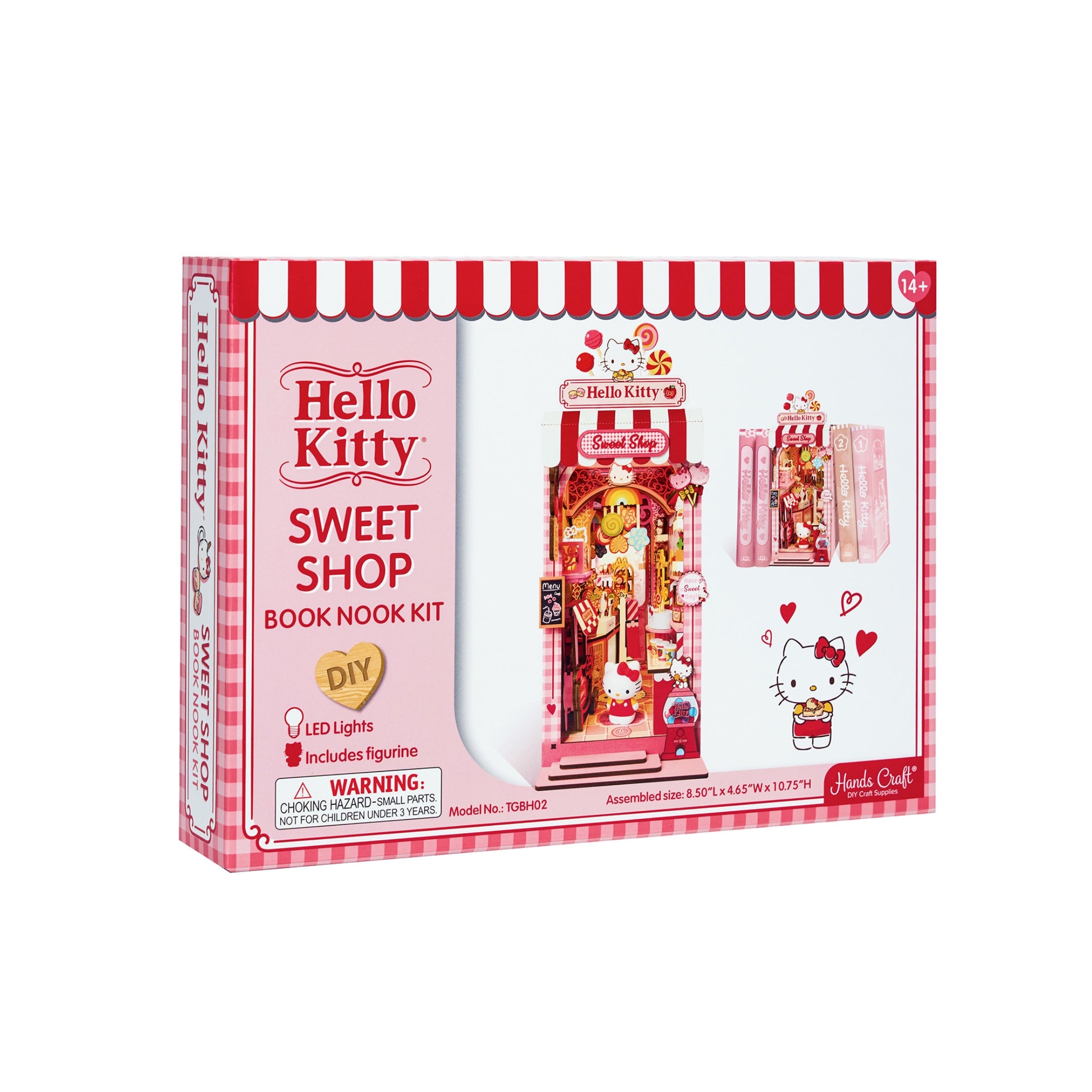 Close-up of miniature candy jars and pastel treats in the finished book nook