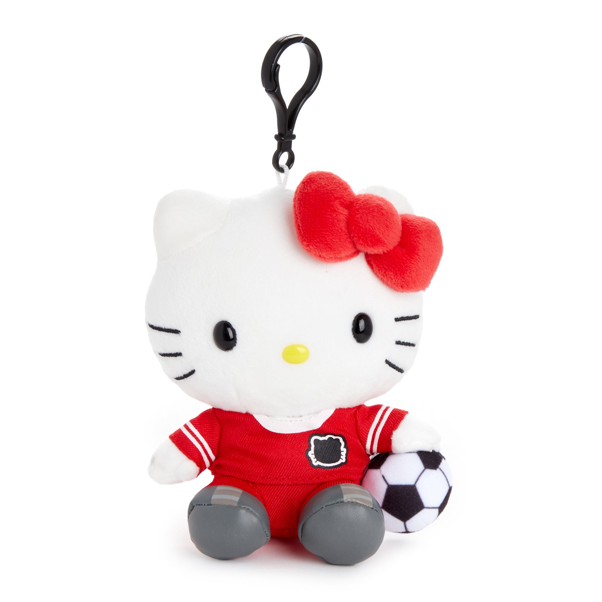 Front view of Hello Kitty soccer mascot plush clipped to a backpack.