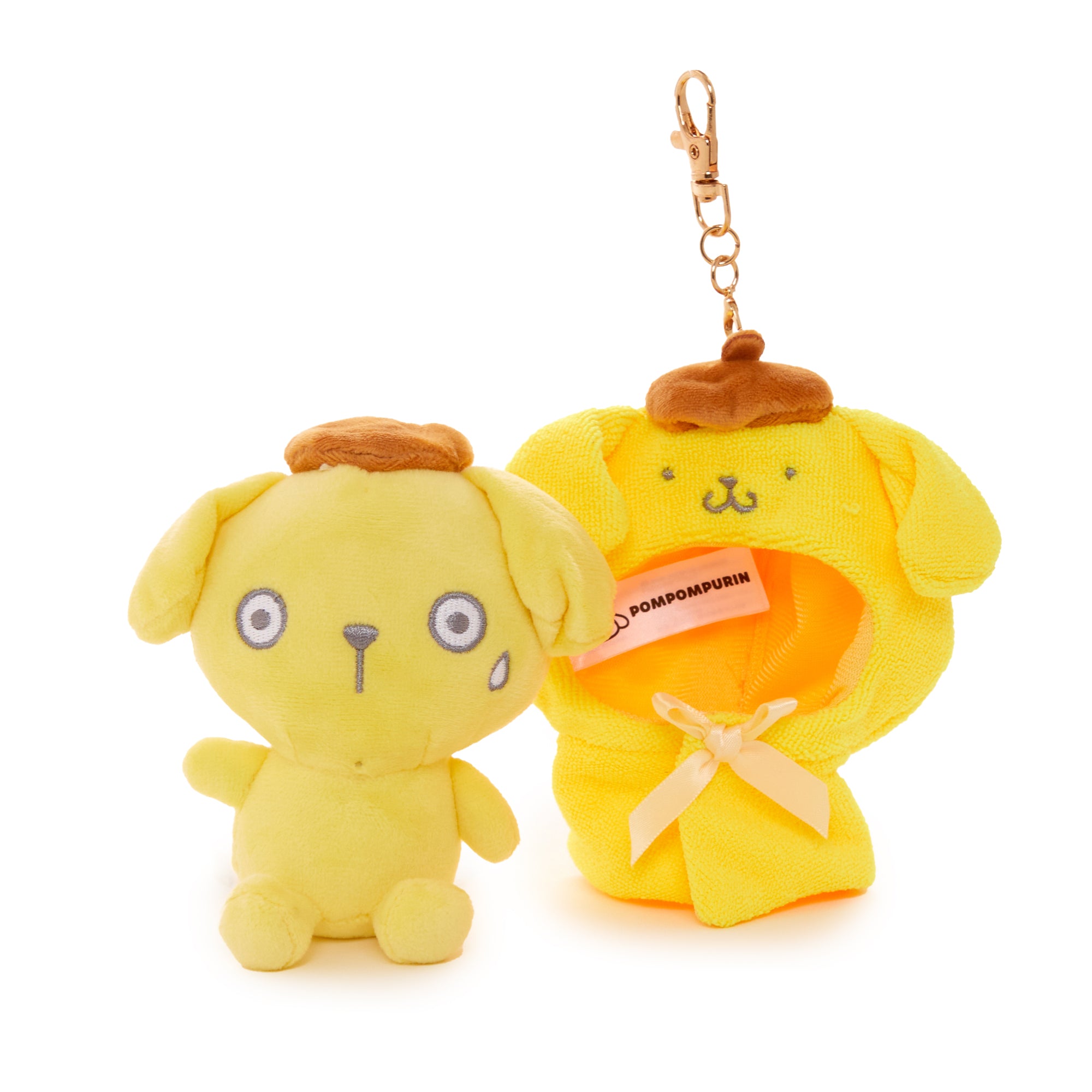 Side view of the Sanrio characters mascot clipped to a canvas travel bag