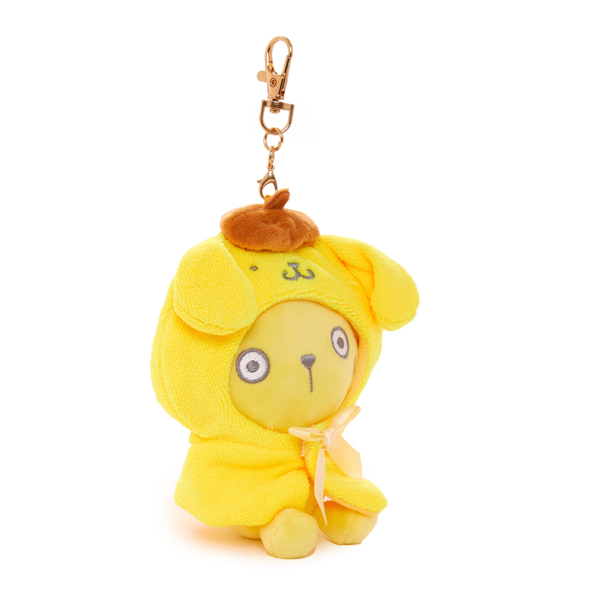 Close-up of Pompompurin plush keychain showing frightened expression and cape