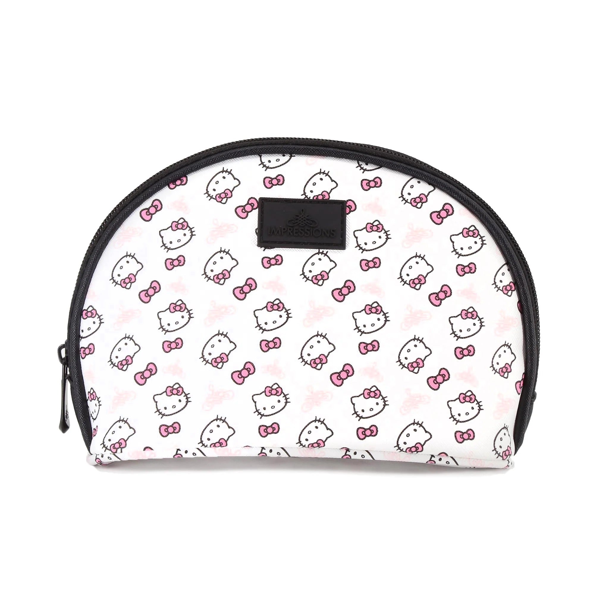 Angled view of hello kitty makeup bags showing size contrast on white bedding