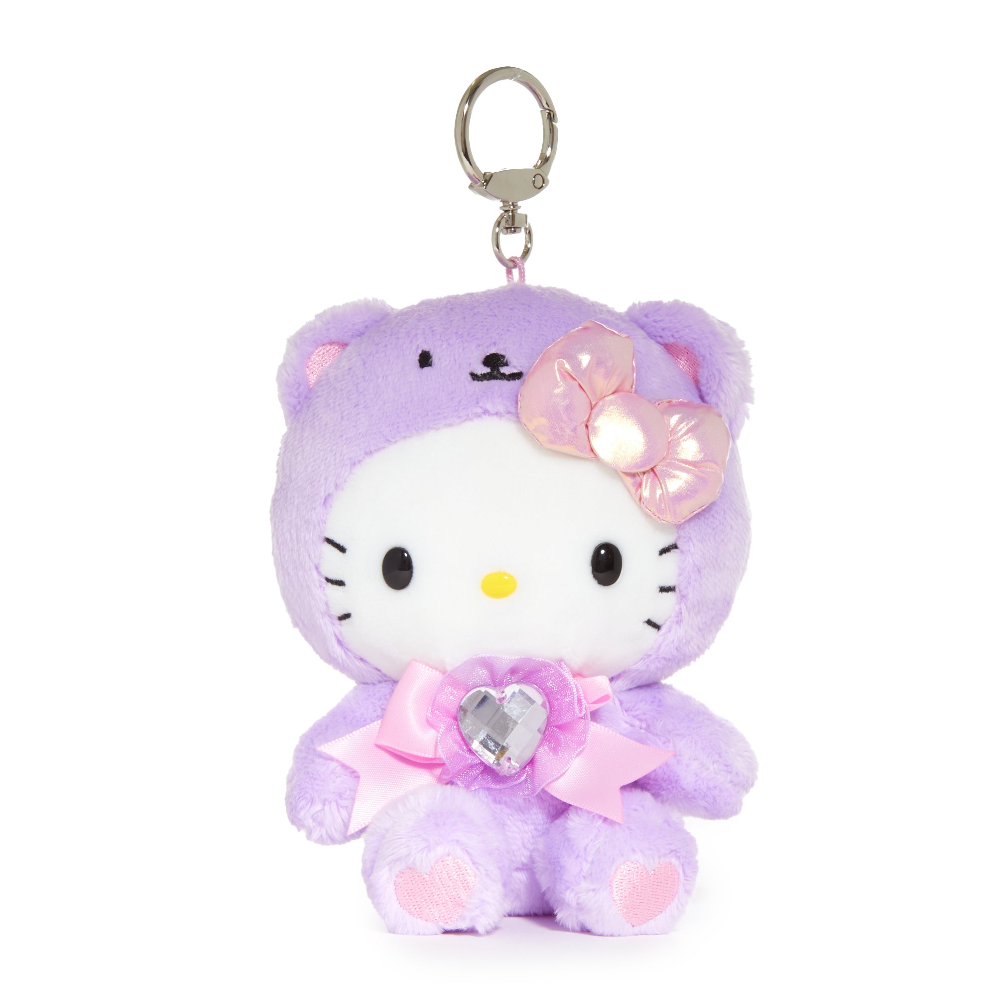 Hello Kitty mascot keychain attached to a backpack zipper, showcasing the sparkling crystal accents