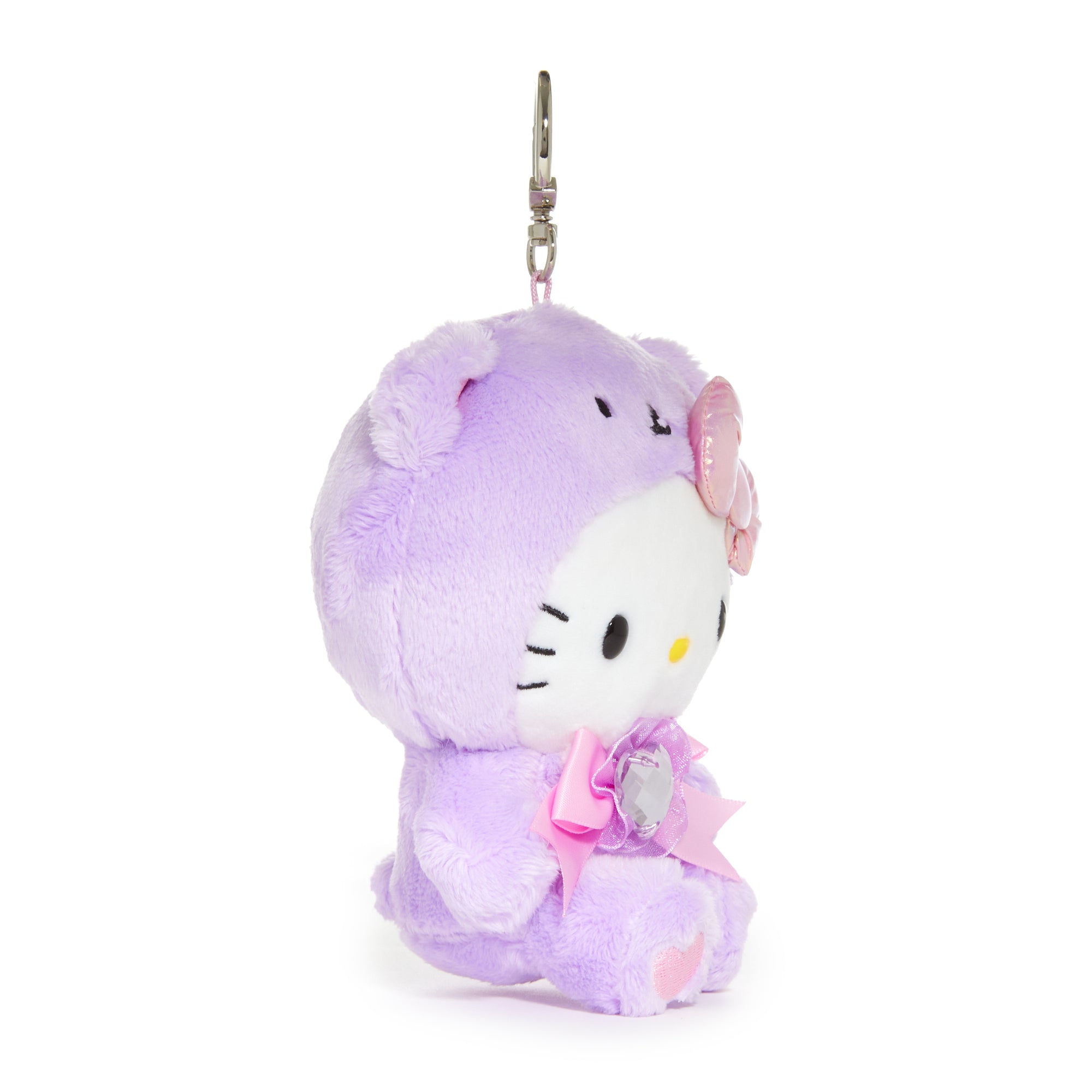 Close-up of Hello Kitty plush keychain with amethyst birthstone and embroidered details