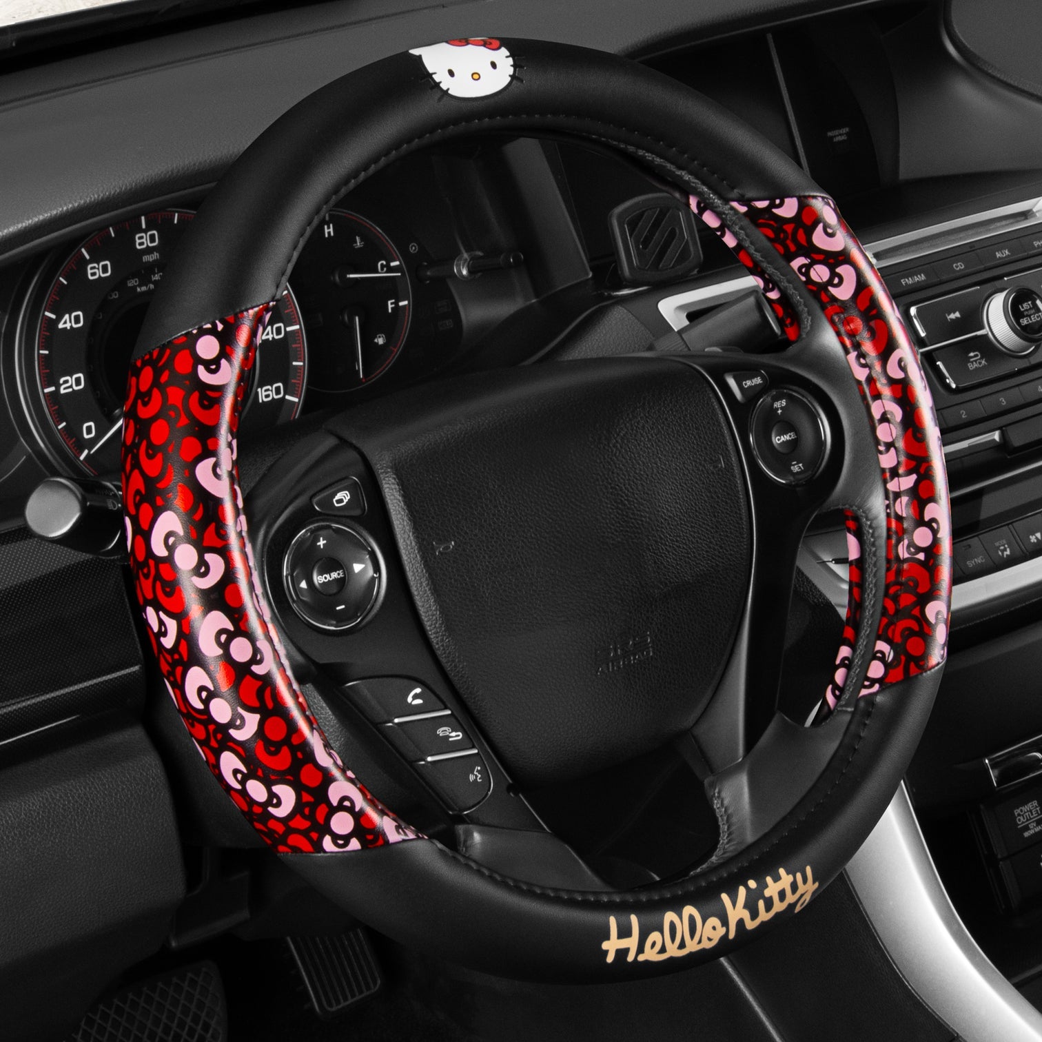 Hello Kitty steering wheel cover installed on a car wheel