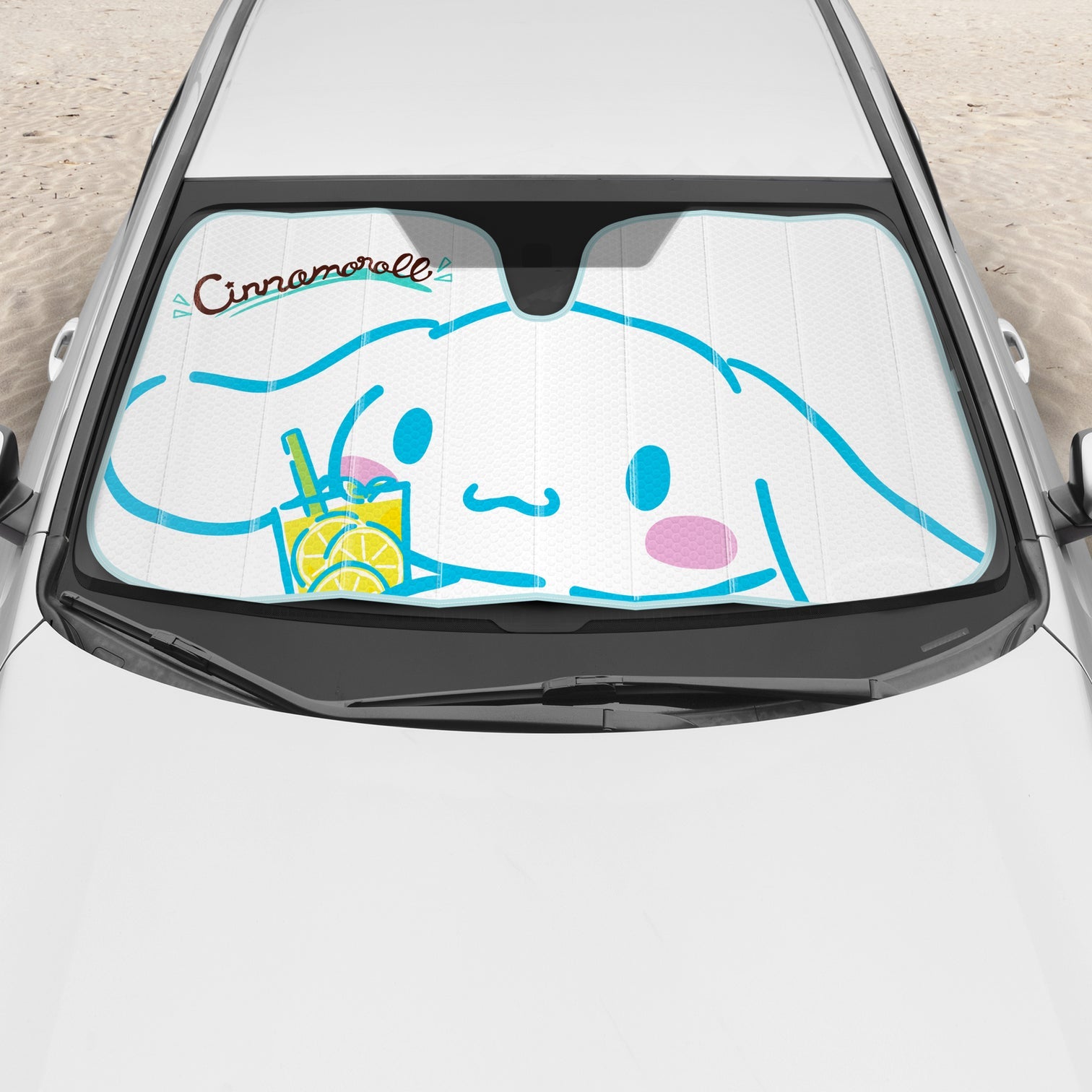 Front view of the sun shade fully opened across a windshield, showcasing the Lemon Chill theme.