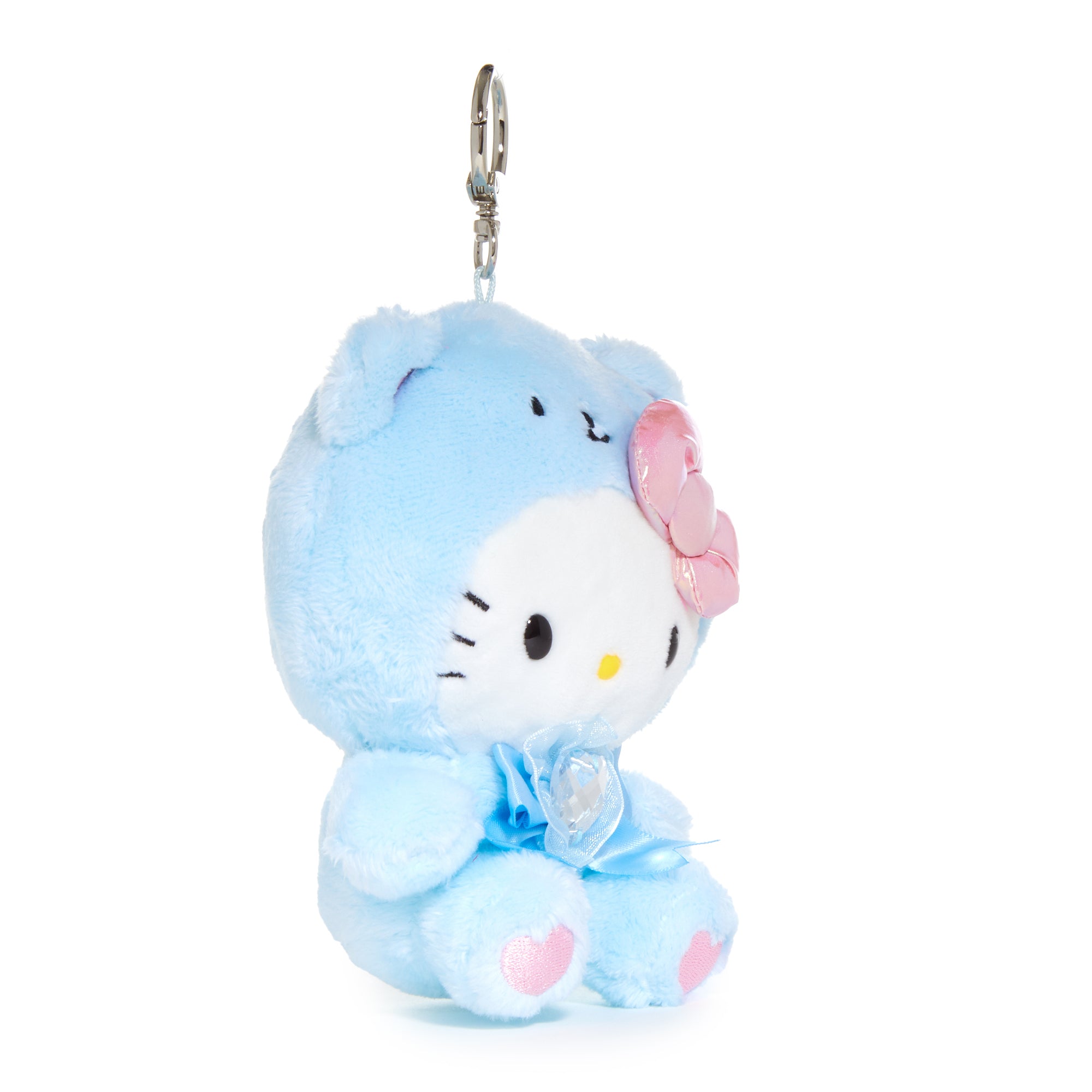 Hello Kitty plush keychain with aquamarine crystal birthstone attached to a backpack