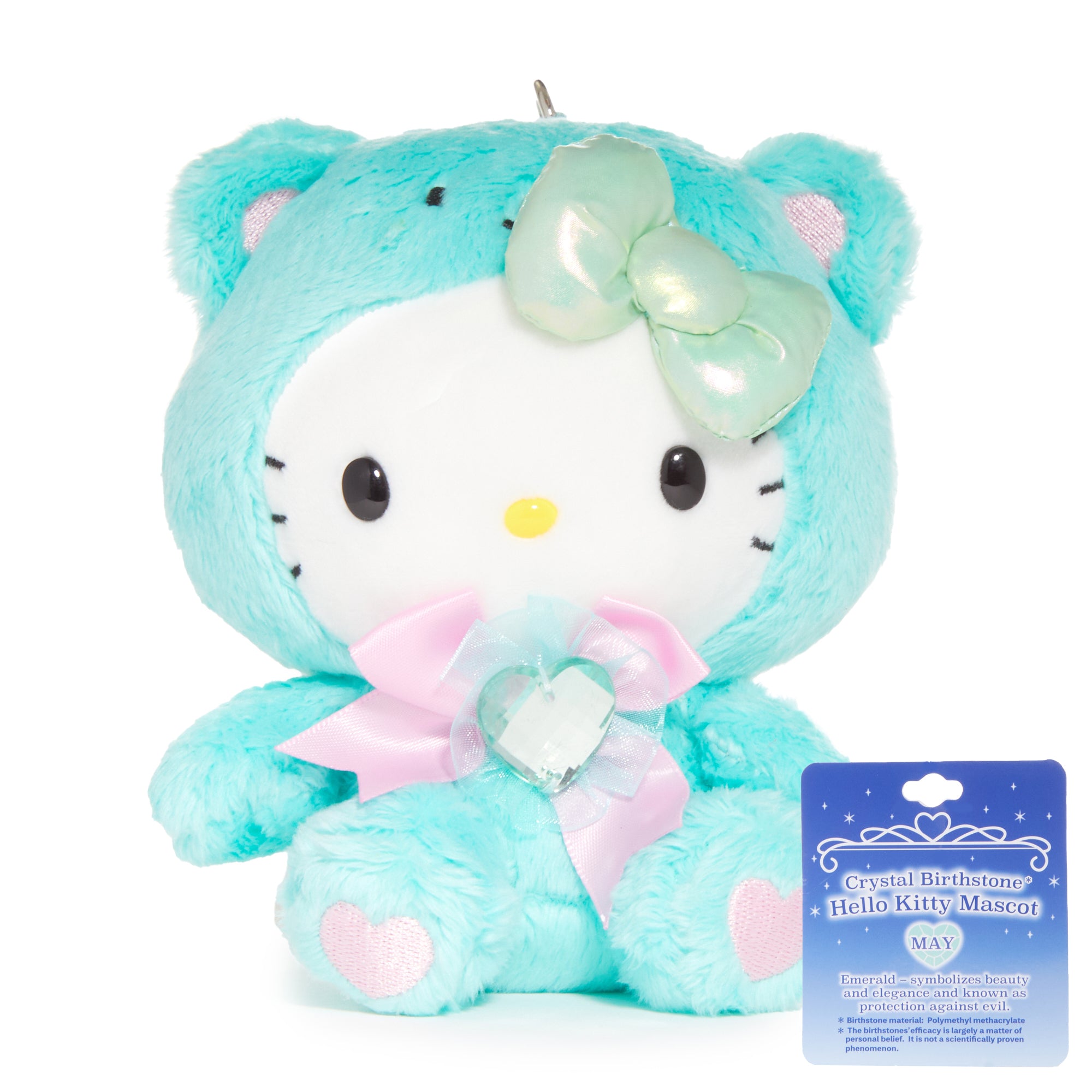 Hello Kitty plush keychain with emerald birthstone dangling from a backpack zipper
