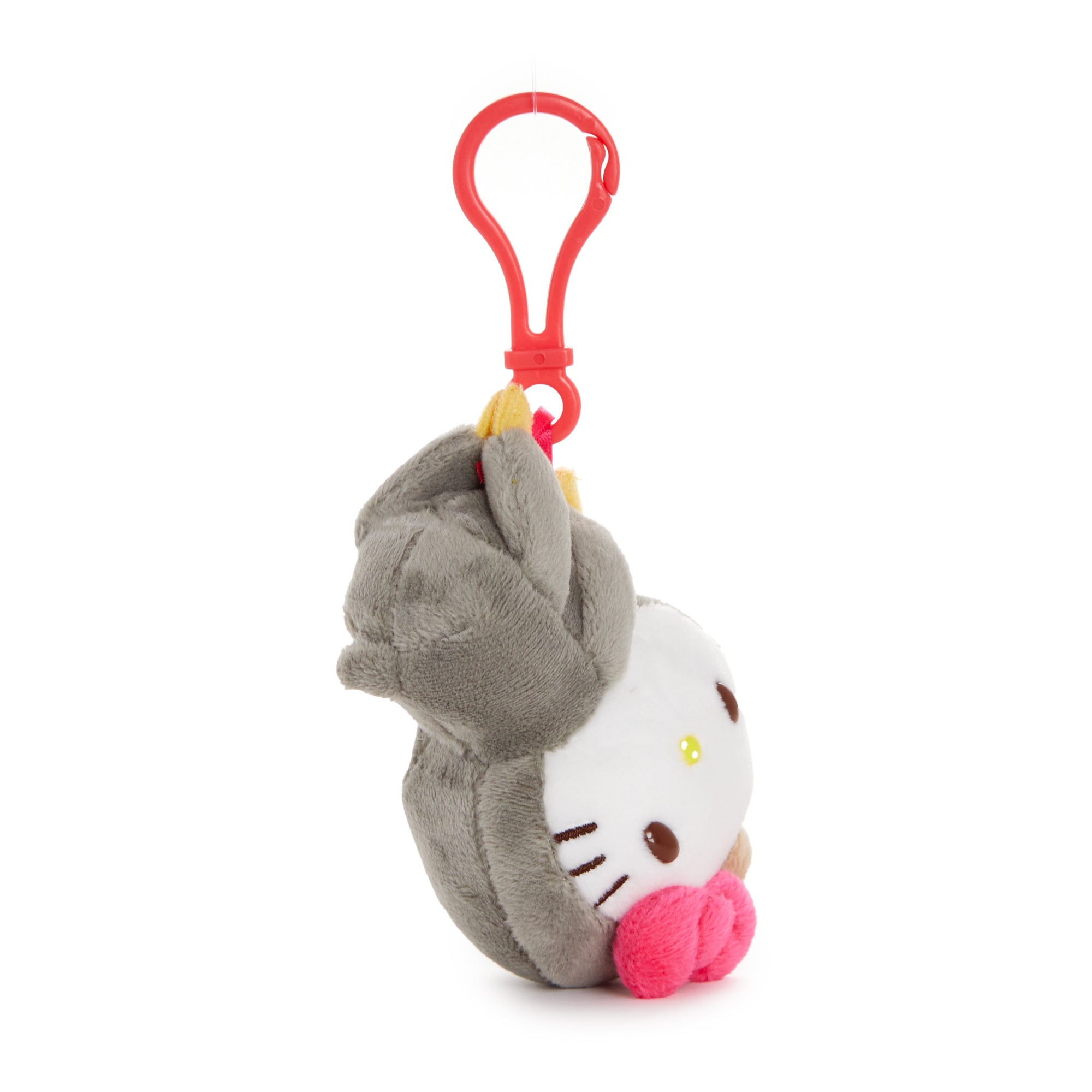 Hello Kitty sloth plush mascot clip hanging on a backpack, detailed embroidery and signature bow visible