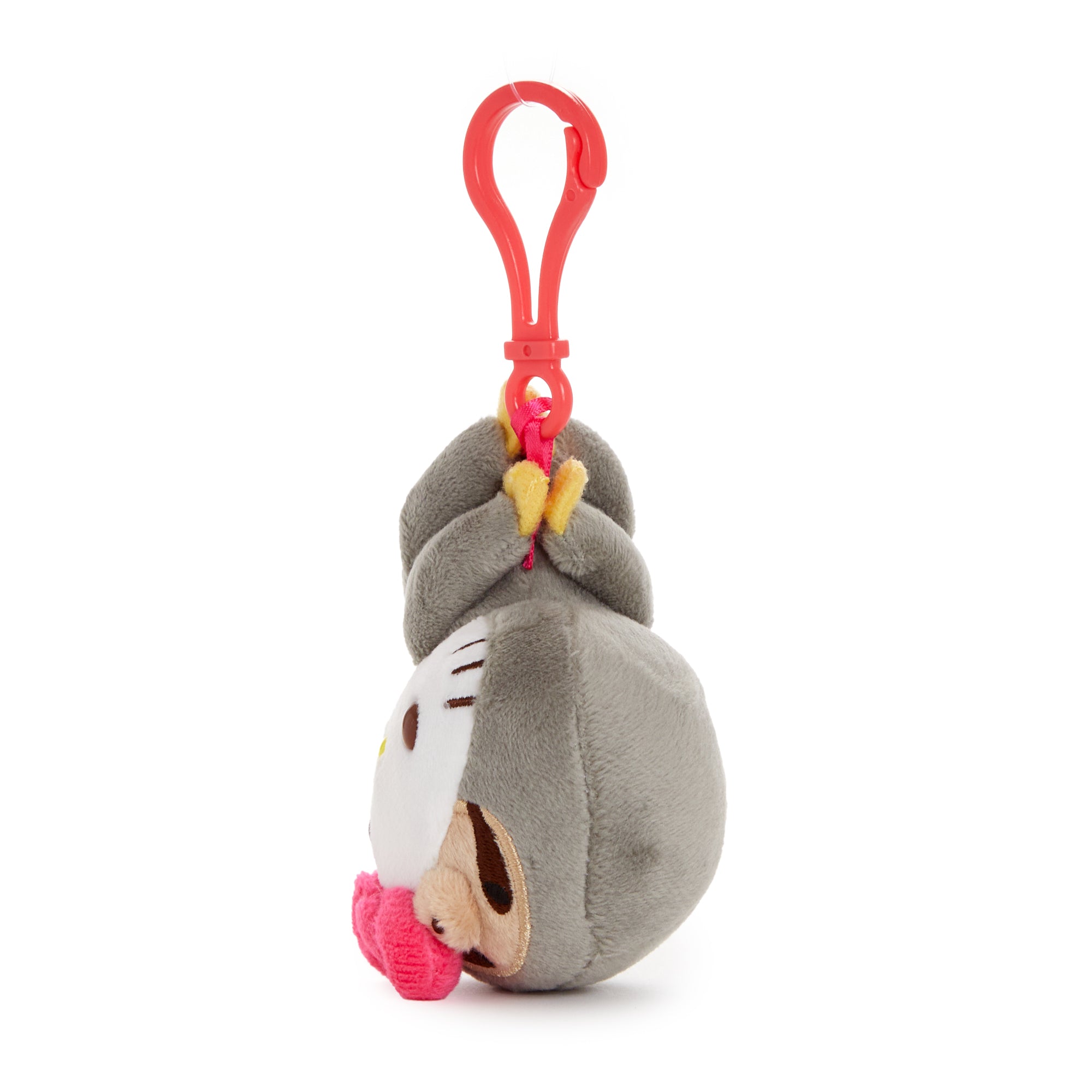 Front view of the Hello Kitty tropical series plush mascot clip with lush jungle background
