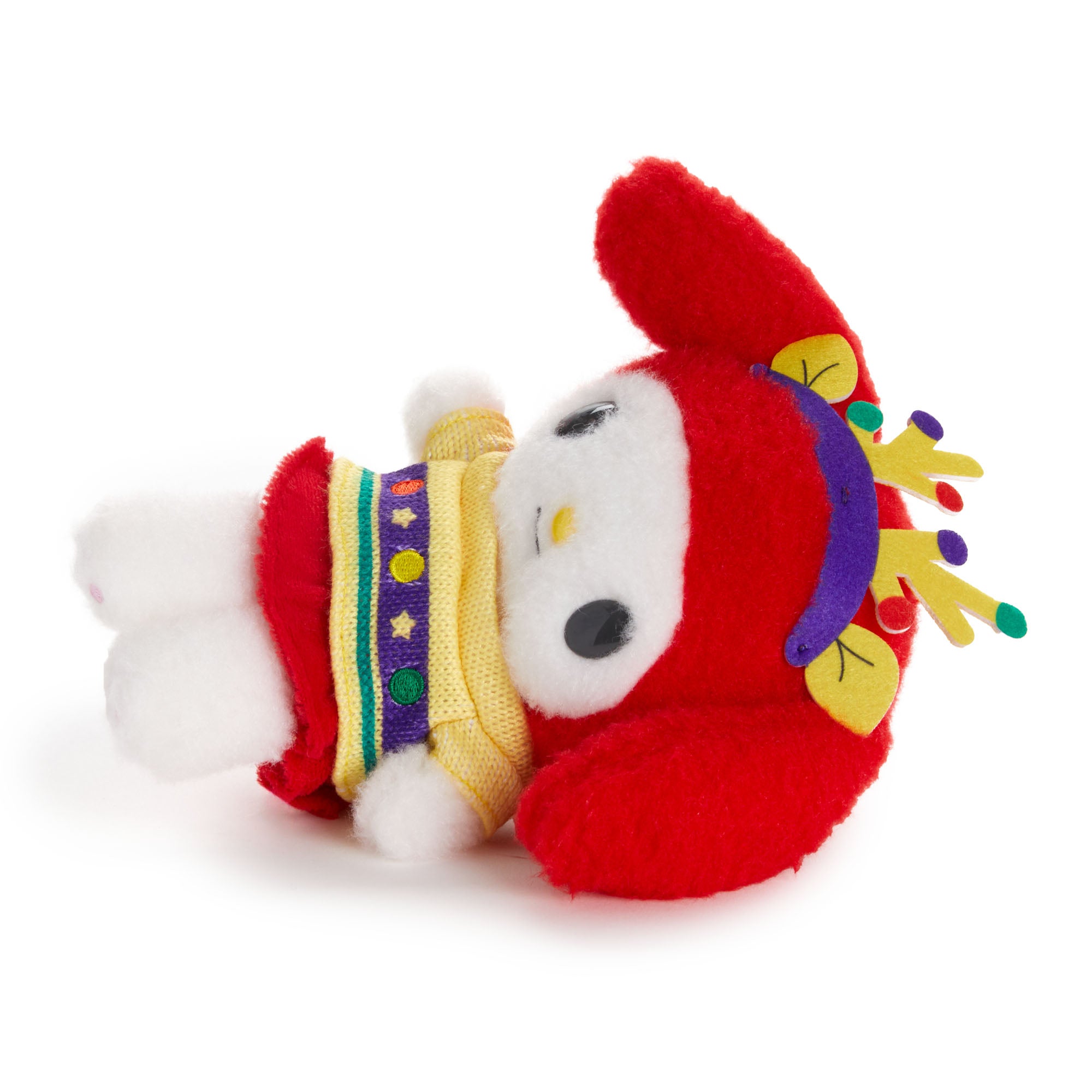My Melody plush toy in a holiday sweater, posed with other Sanrio characters in a festive holiday setting