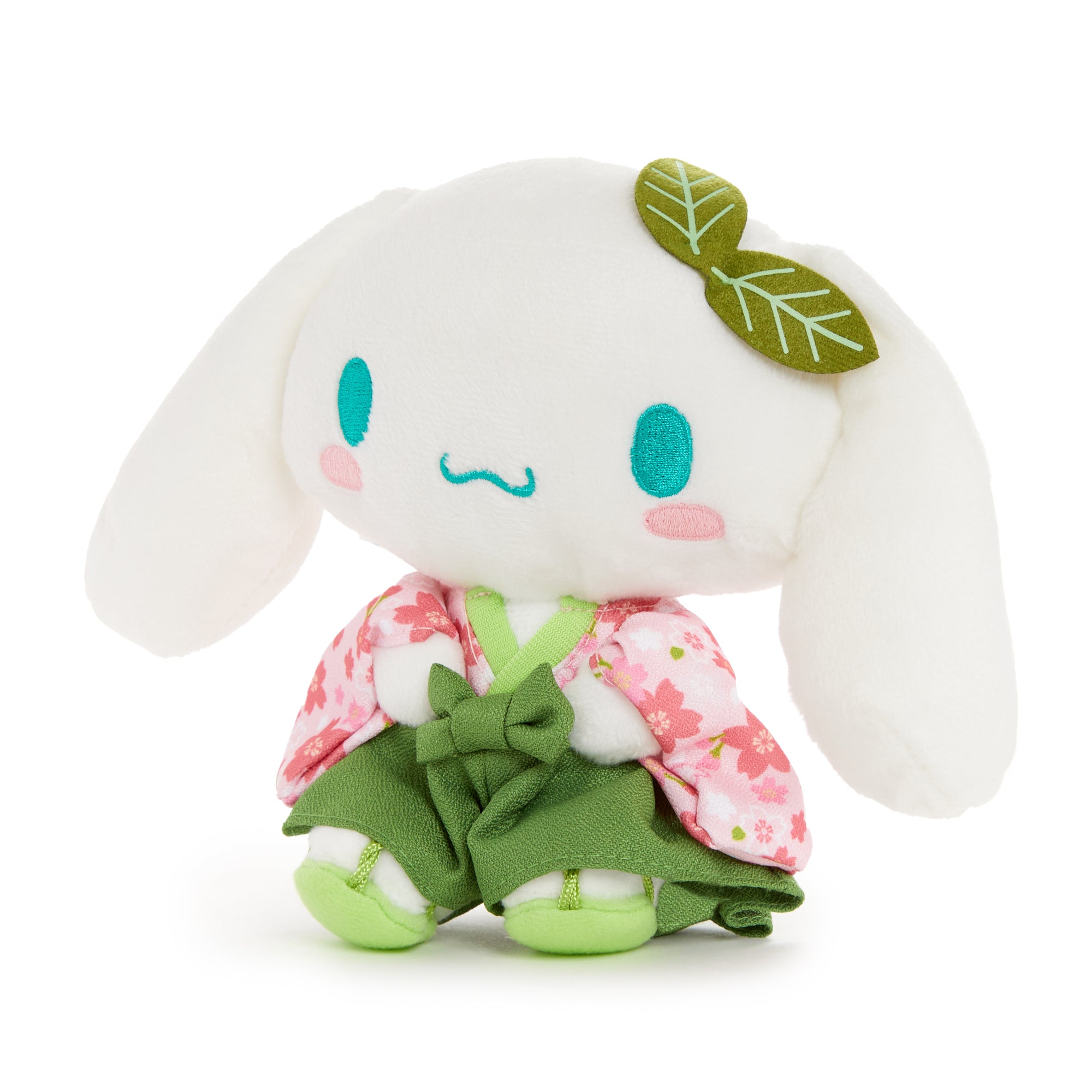 Close-up of the large Cinnamoroll plush with rosy cheeks and embroidery.