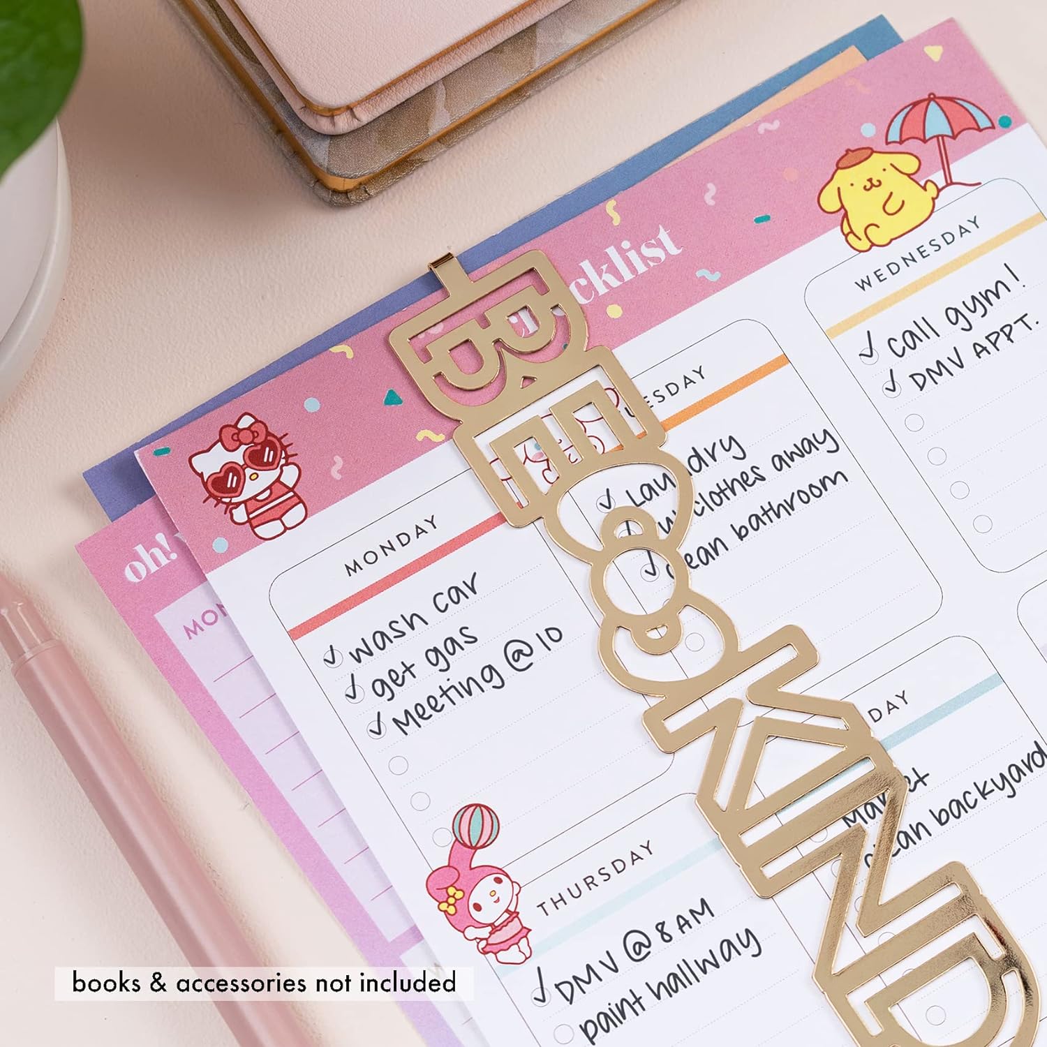 Planner bookmark styled on an open notebook beside coffee mug
