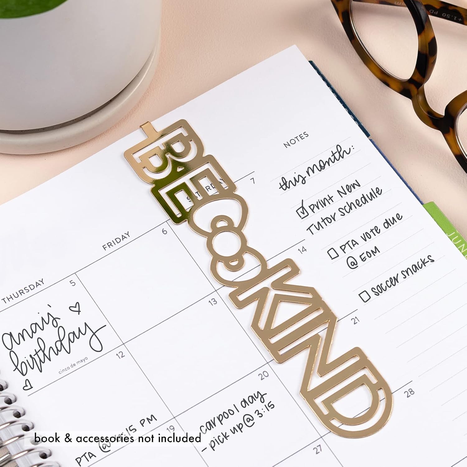 Planner bookmark styled on an open notebook beside coffee mug