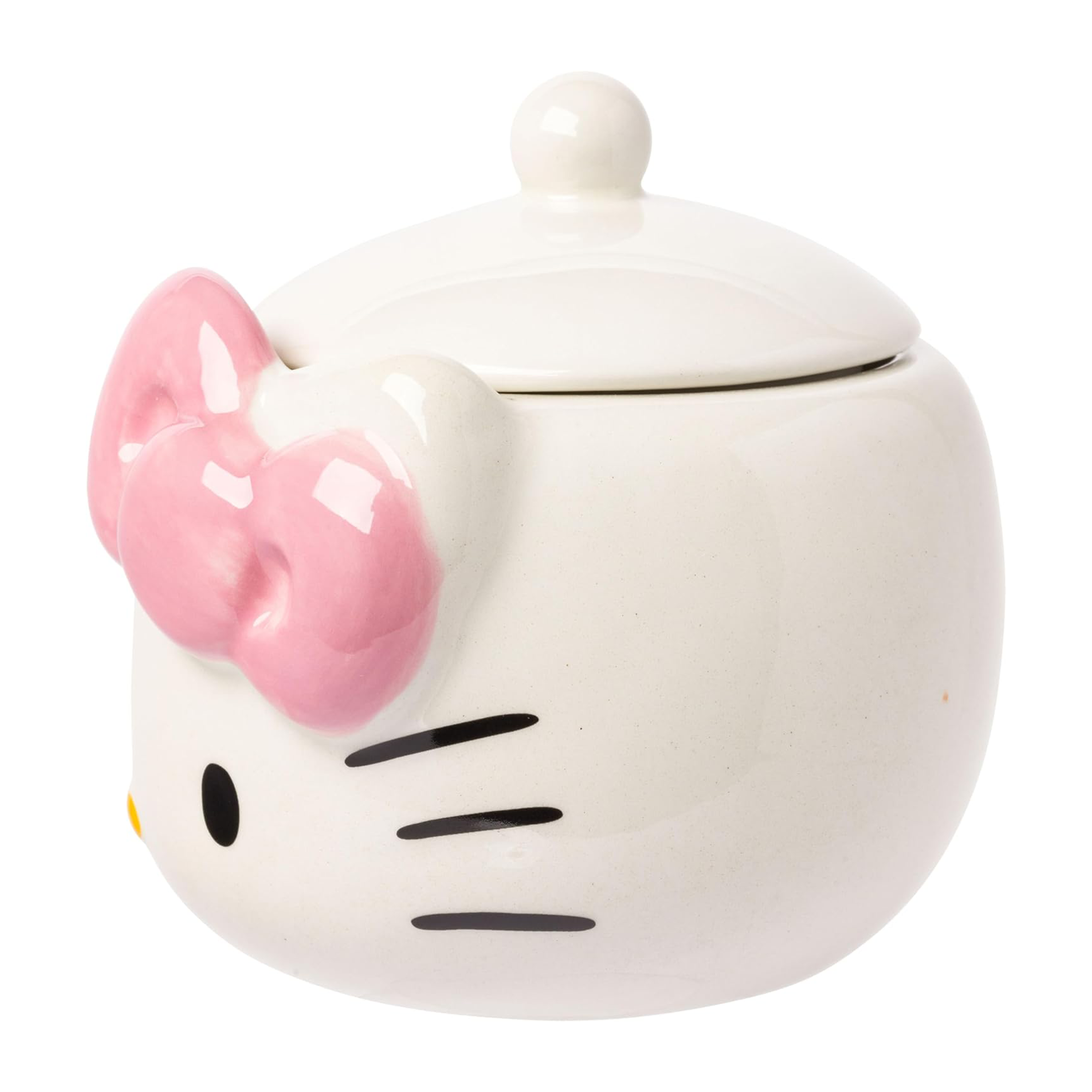 Hello Kitty ceramic snack jar with pink bow, filled with colorful snacks on a kitchen counter.