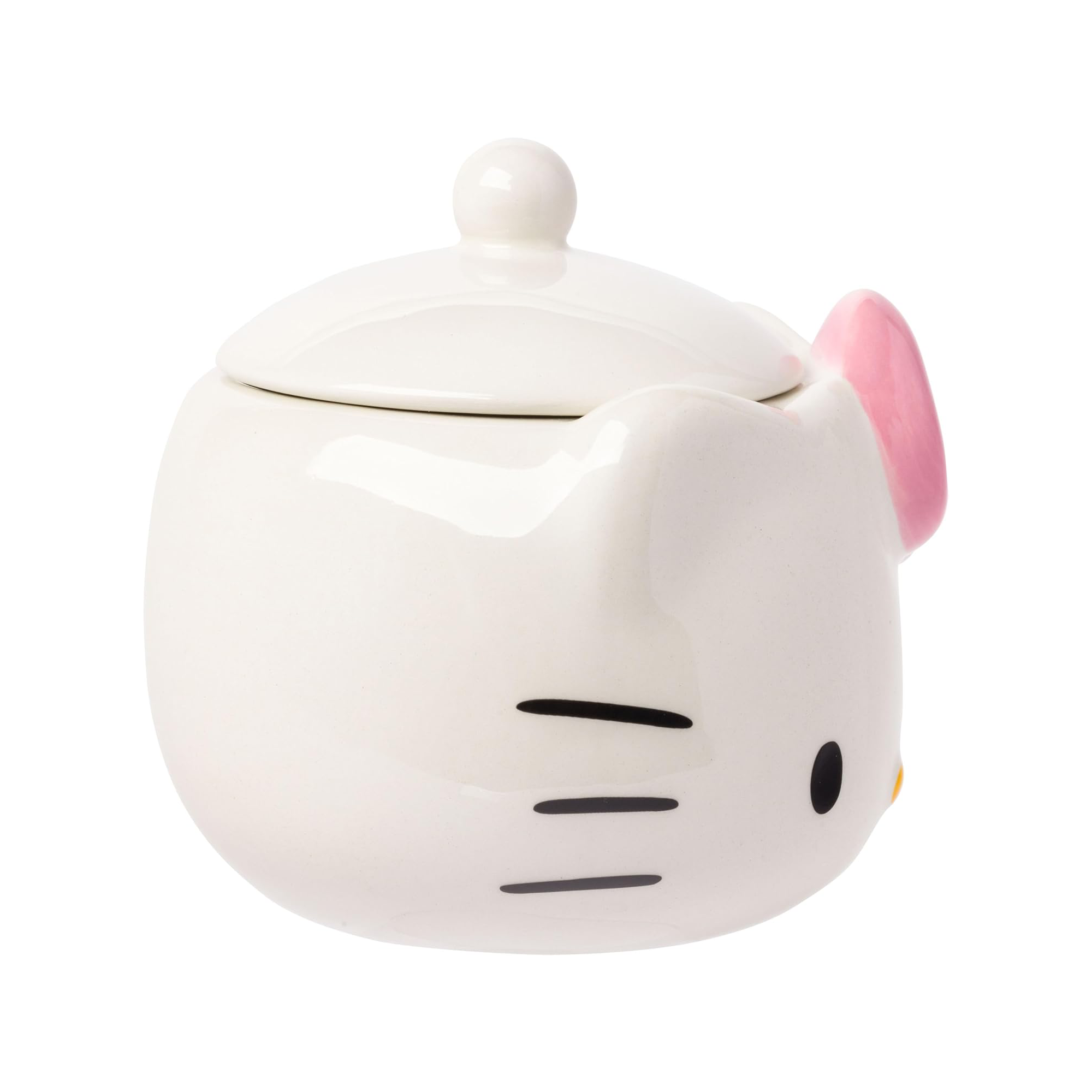 Hello Kitty ceramic jar being used as a desk organizer for pens and pencils.
