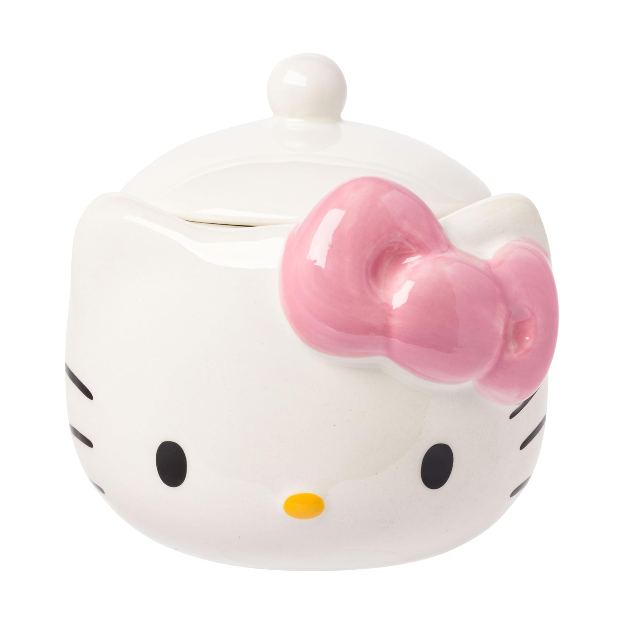 Hello Kitty ceramic snack jar with pink bow, filled with colorful snacks on a kitchen counter.