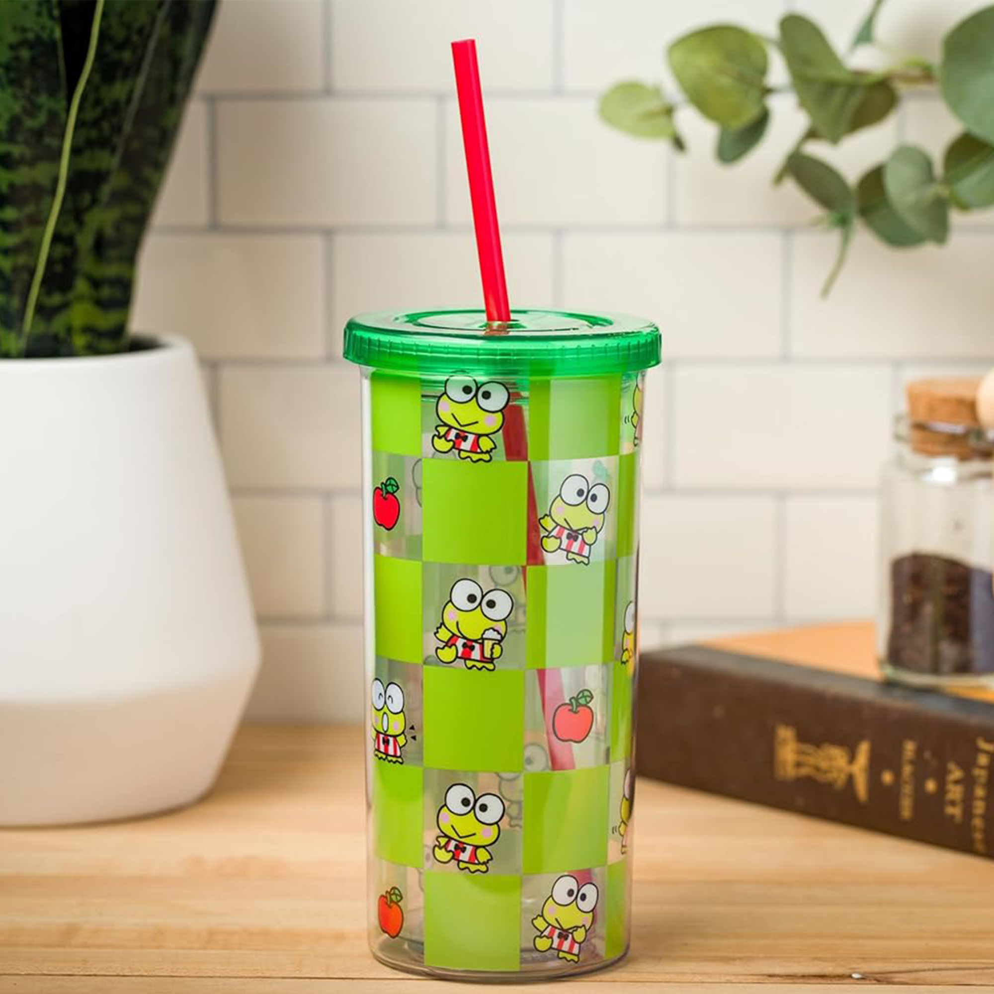 Close-up view of the Keroppi travel tumbler lid and straw.