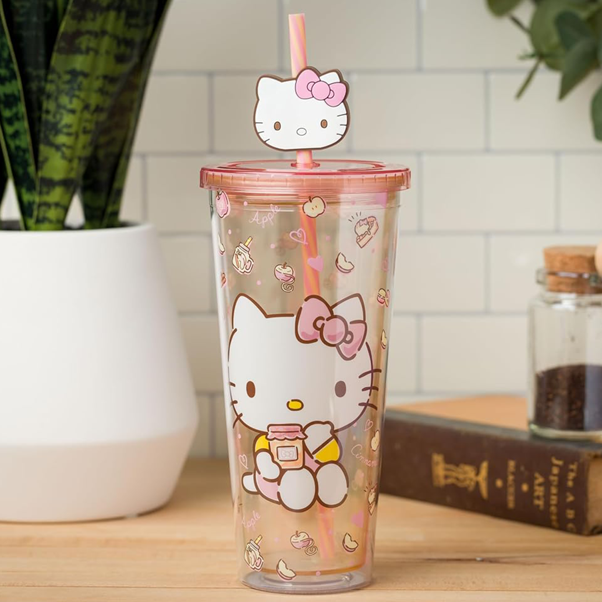 Hello Kitty 24oz apples and cinnamon tumbler in use, showcasing its durability and design