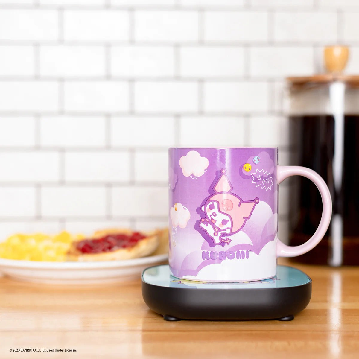 Kuromi Mug Warmer in use, keeping coffee warm on a kitchen counter