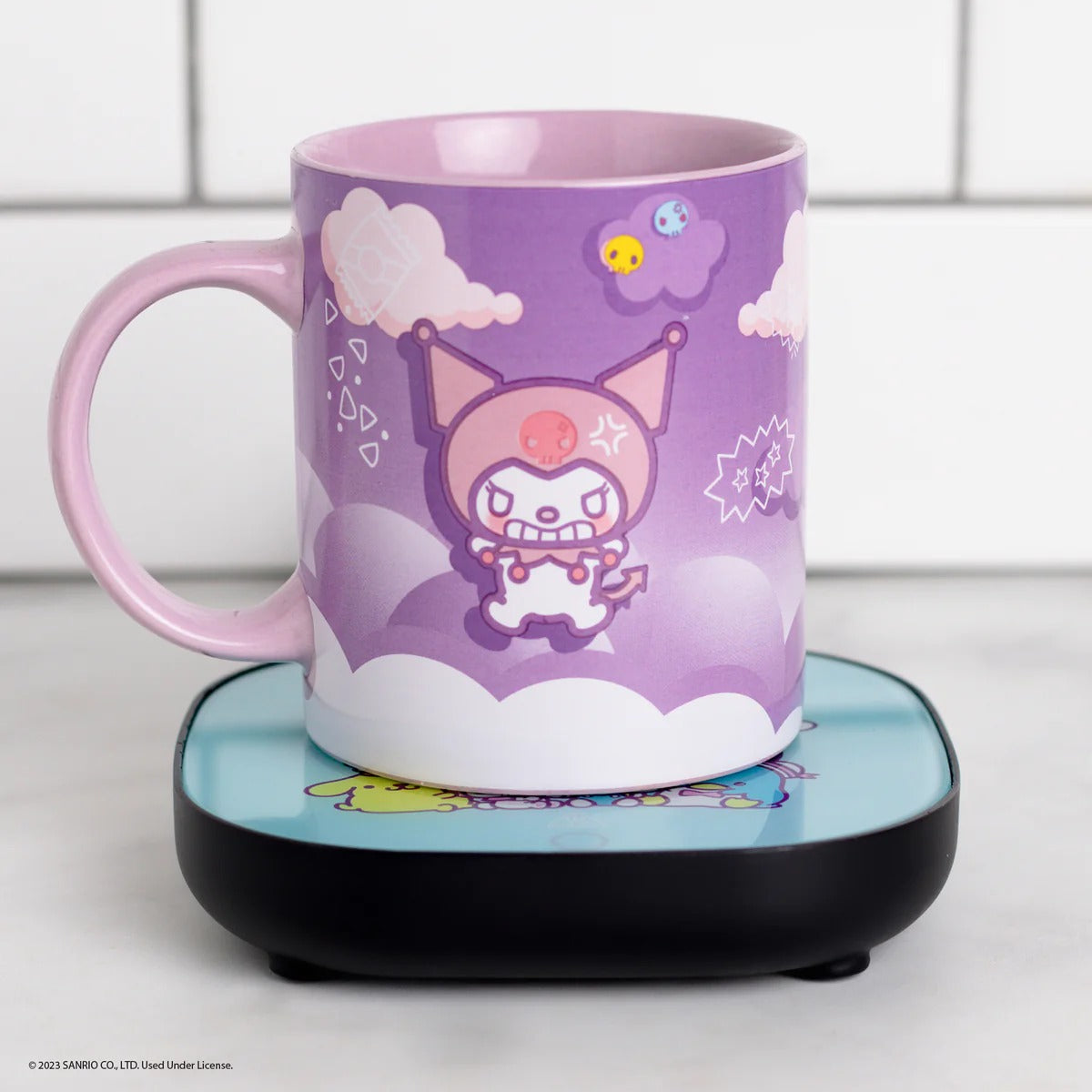 Kuromi Mug Warmer in use, keeping coffee warm on a kitchen counter
