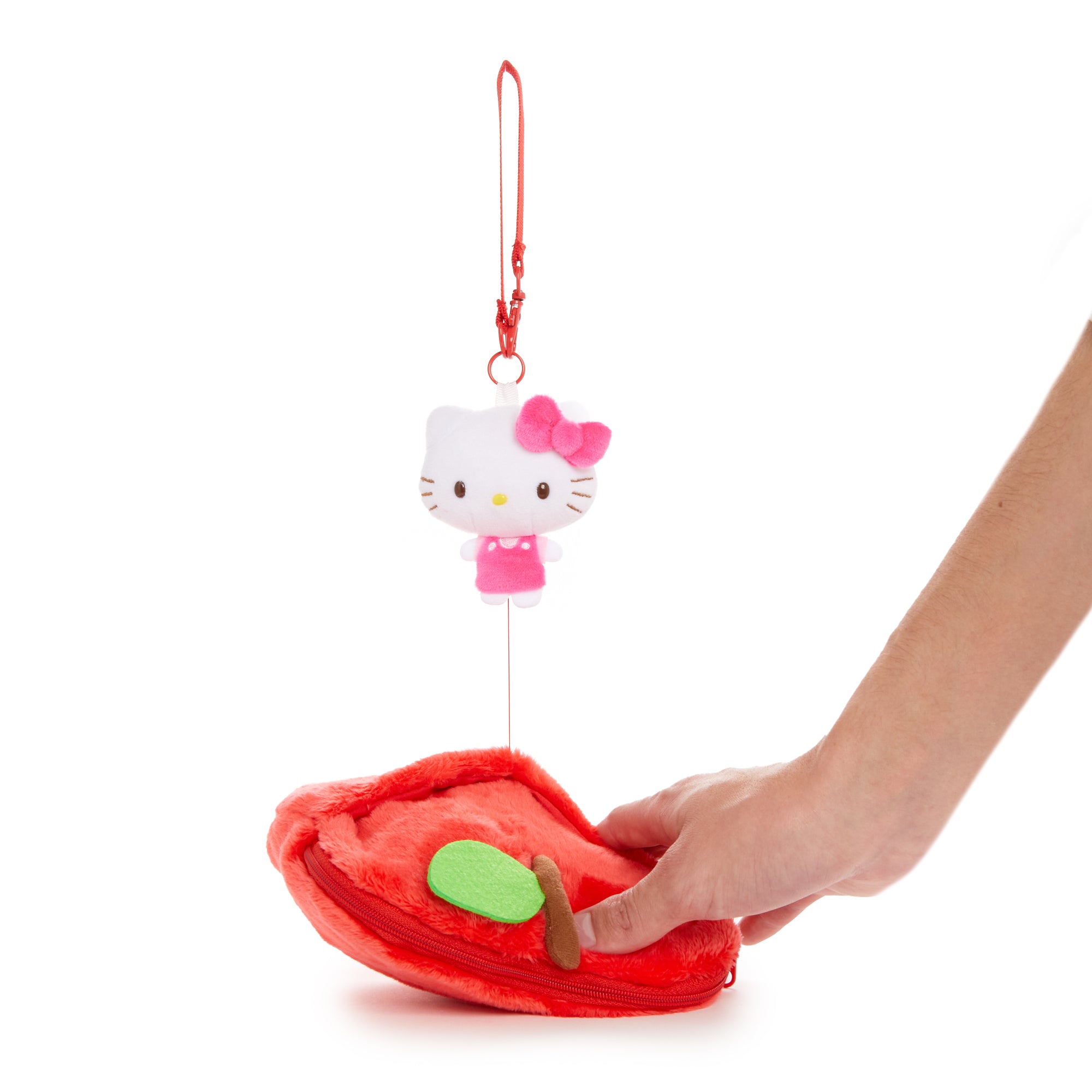 Hello Kitty pouch held in hand, demonstrating size and usability.