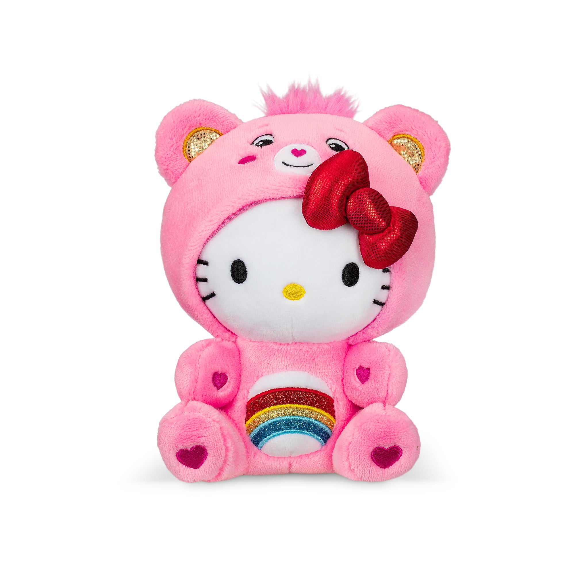 Front view of Hello Kitty plush and Cheer Bear plush sitting side by side on a pastel bedspread.