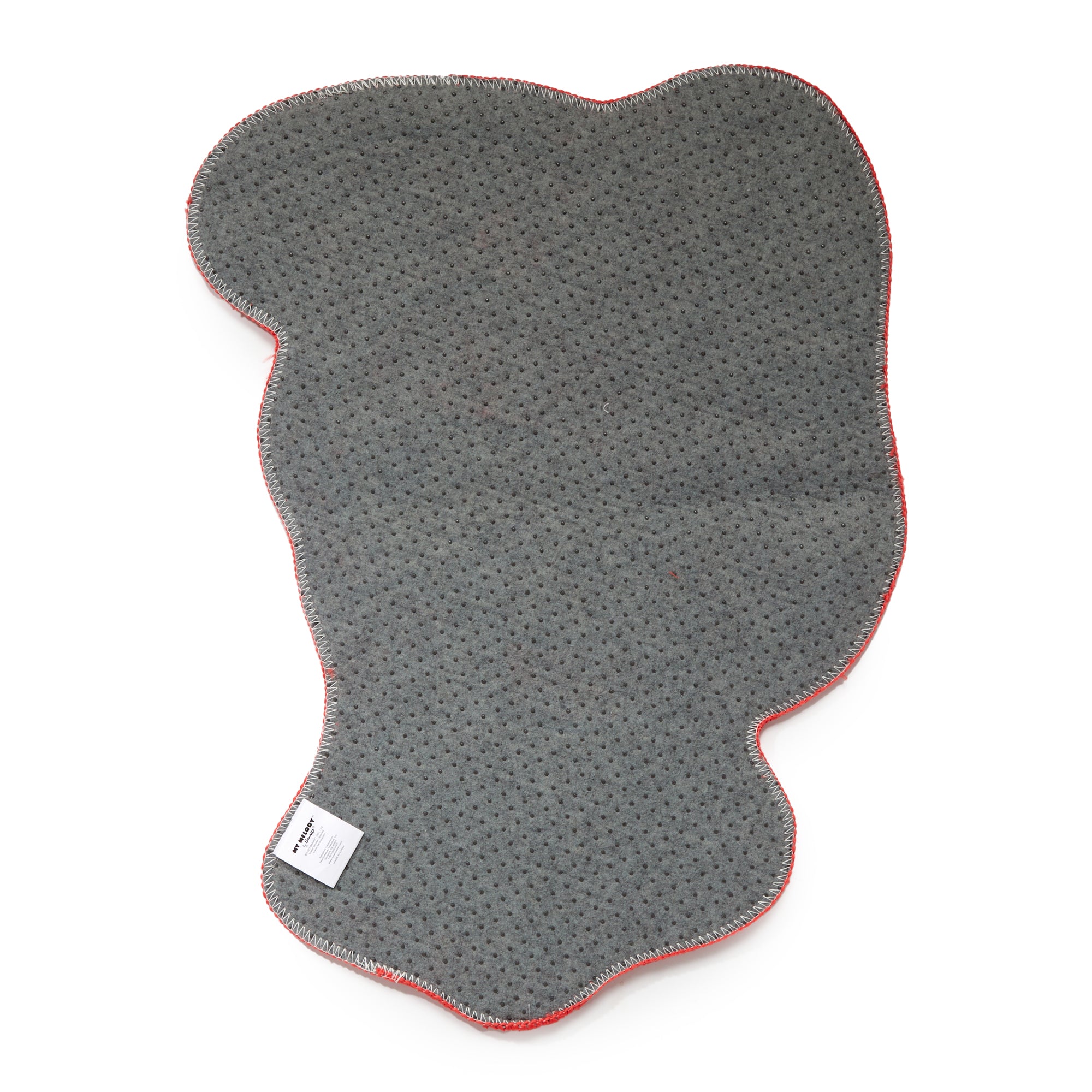 My Melody accent rug placed in a bedroom, highlighting its low pile texture