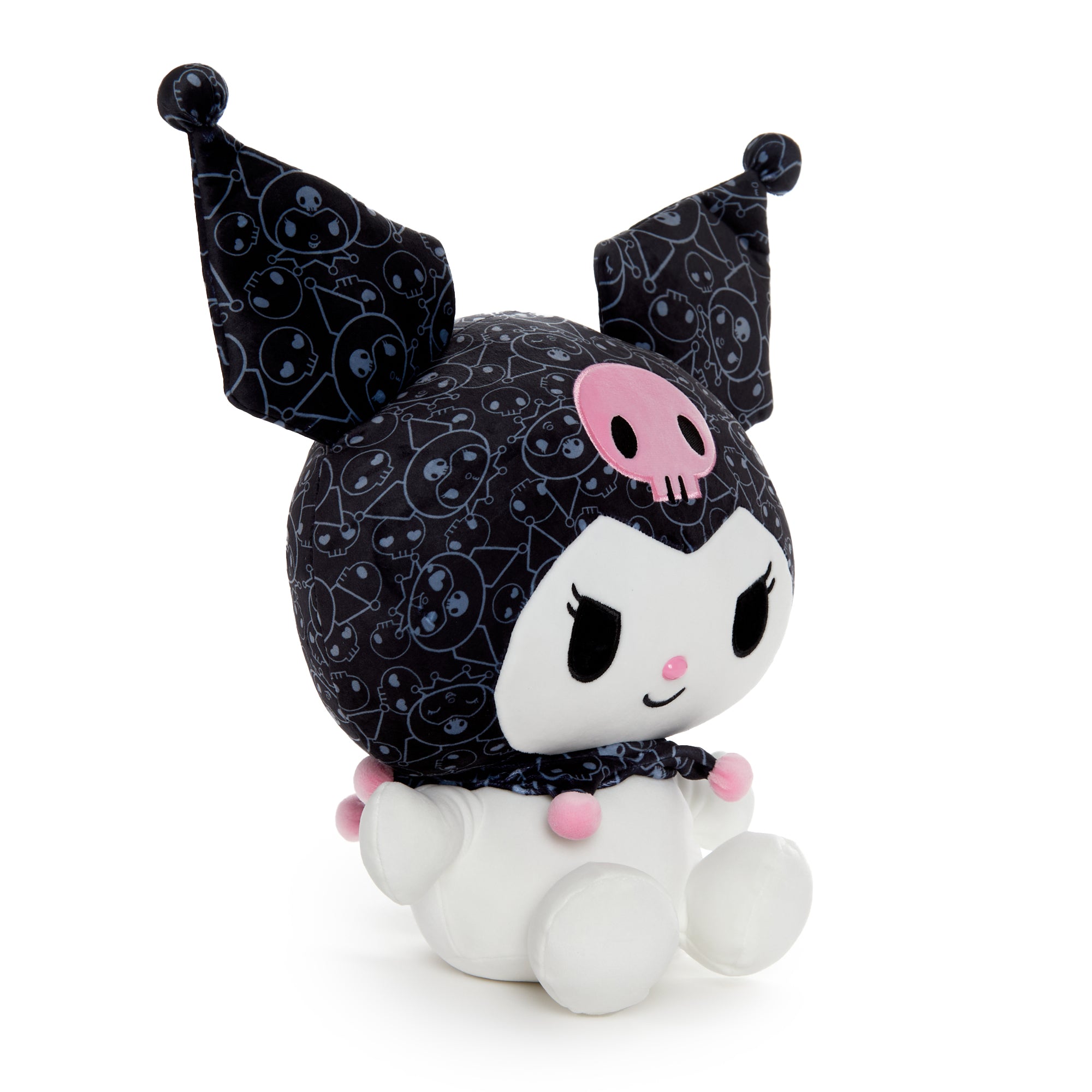 Kuromi plush toy sitting on a bed, showcasing its embroidered details