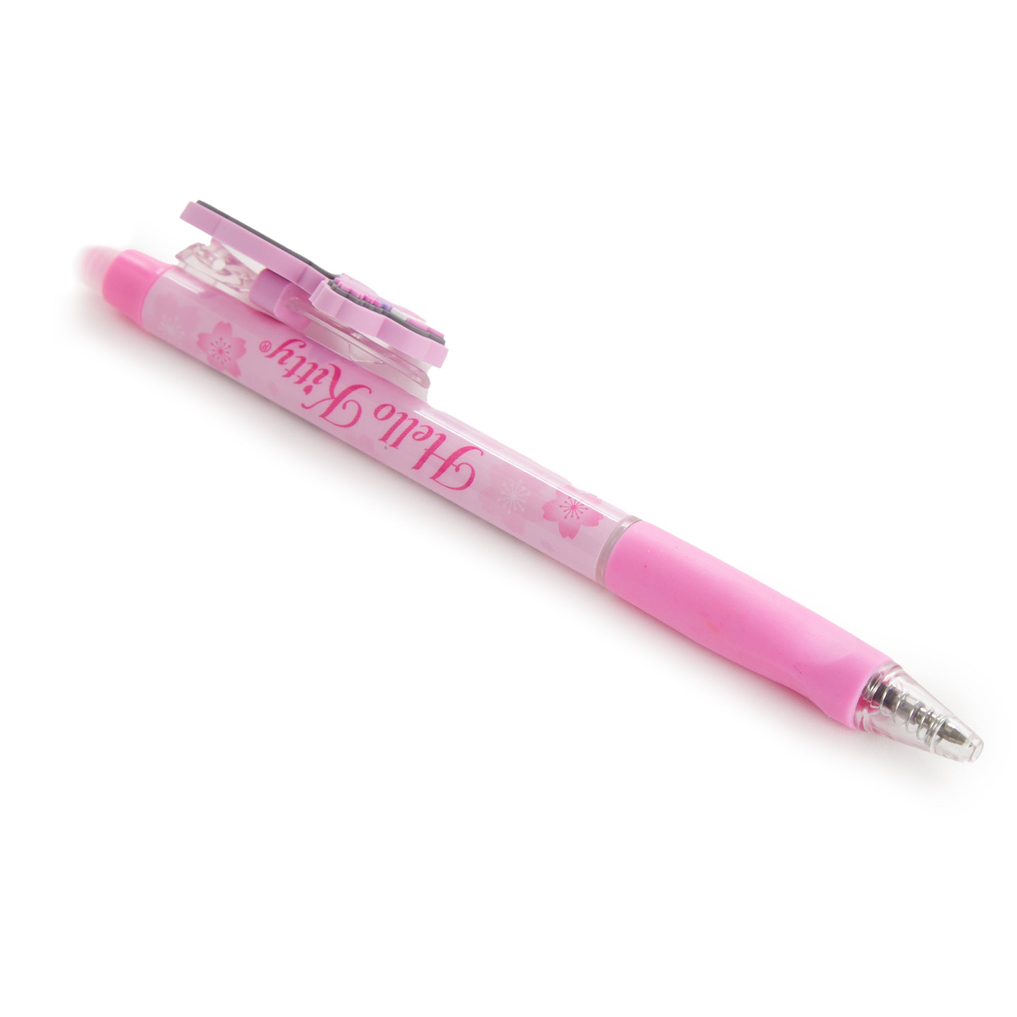 Lifestyle shot of a Hello Kitty pen being used in a journal outdoors.