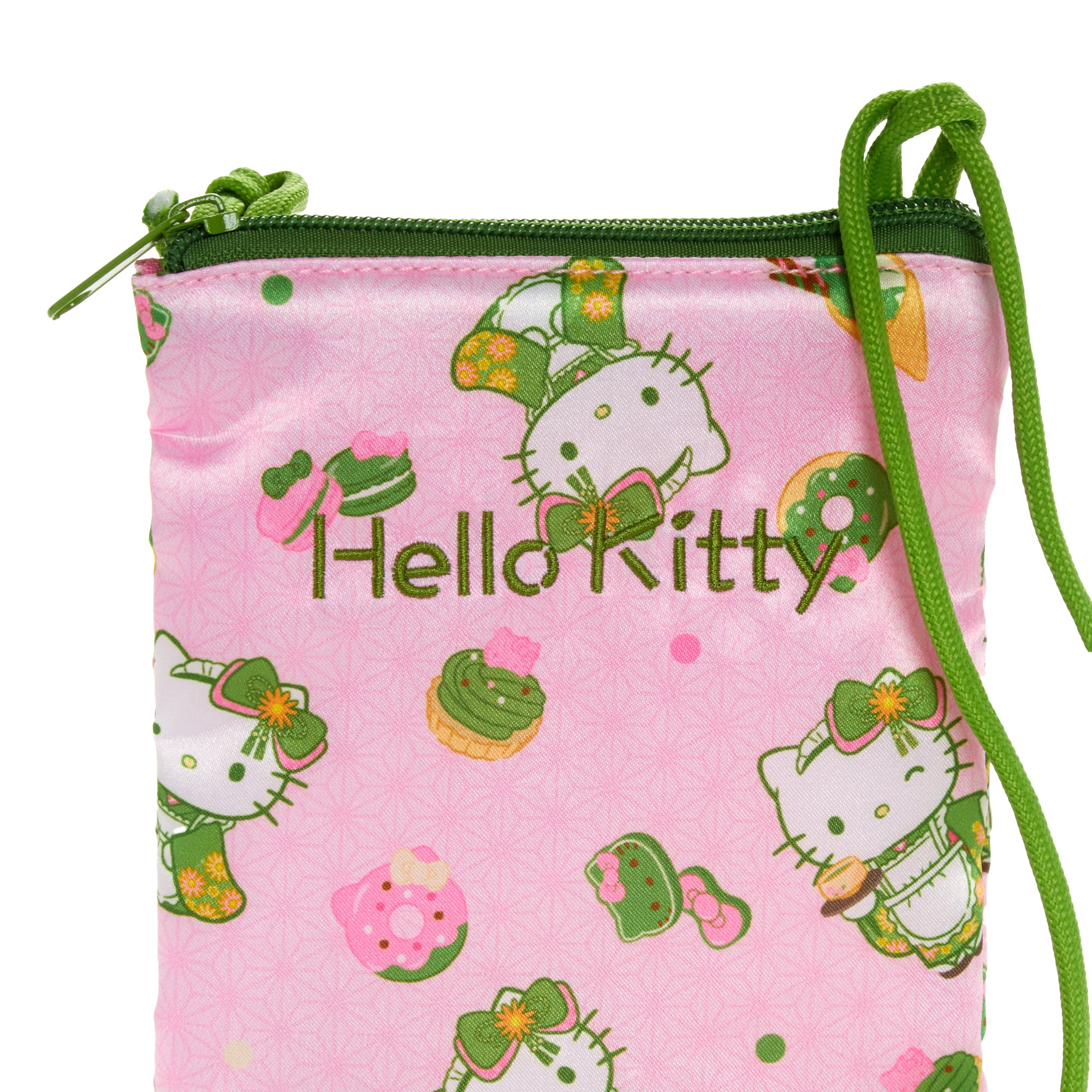 Hello Kitty phone bag displayed with matching accessories on a table