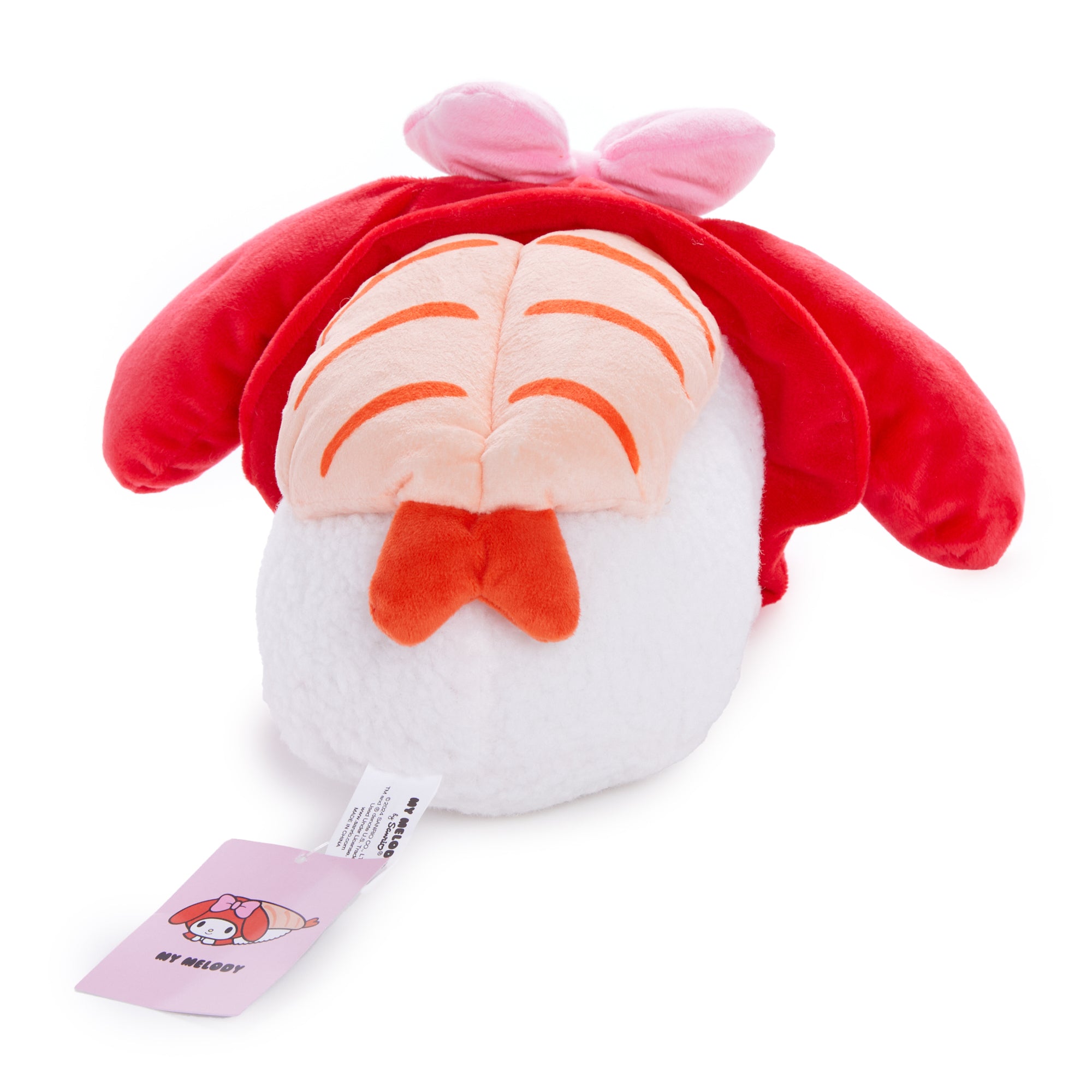 My Melody sushi plush displayed on a shelf with other Sanrio collectibles