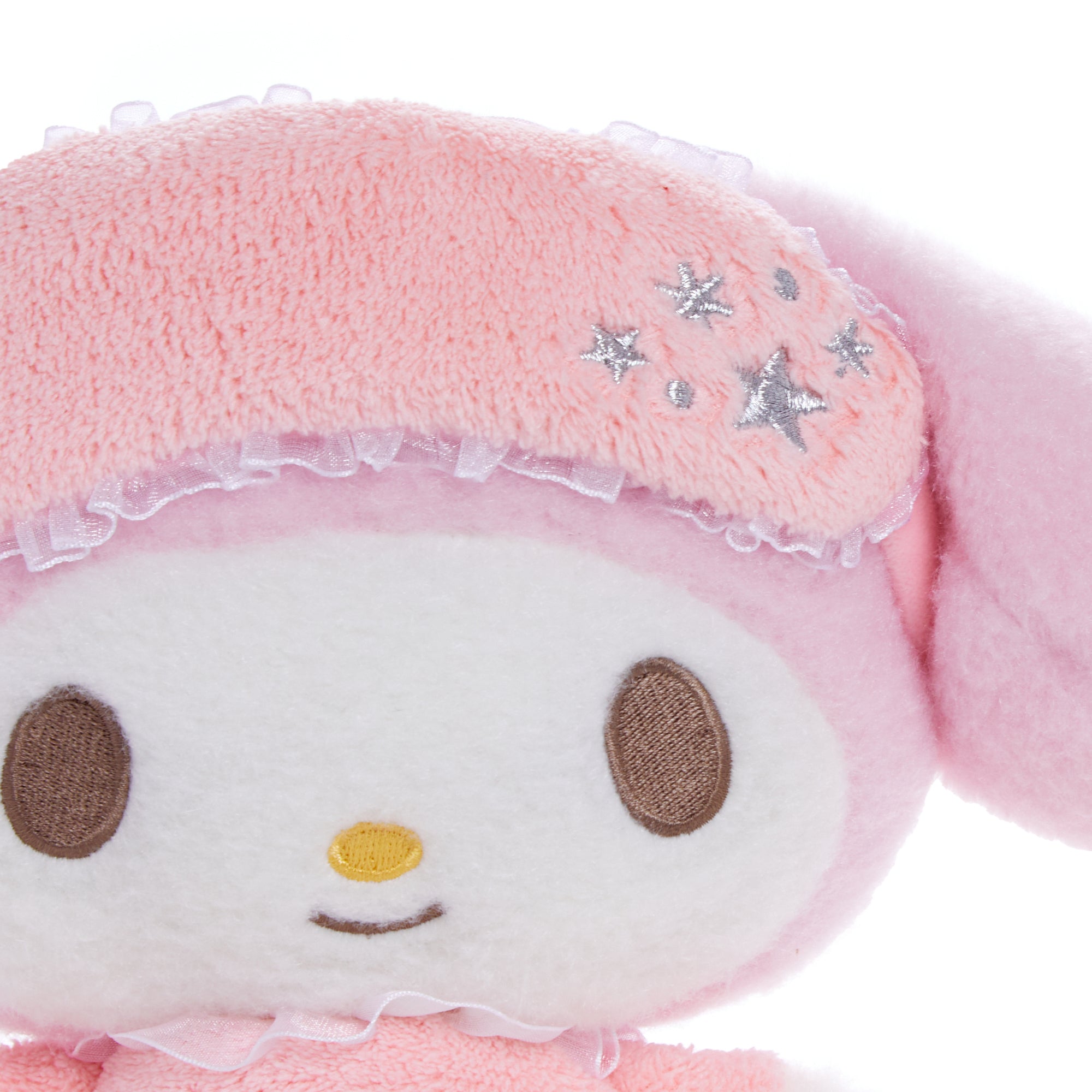 Sweet Dreams Sanrio plush nestled in pastel bed linens, ideal for nighttime use