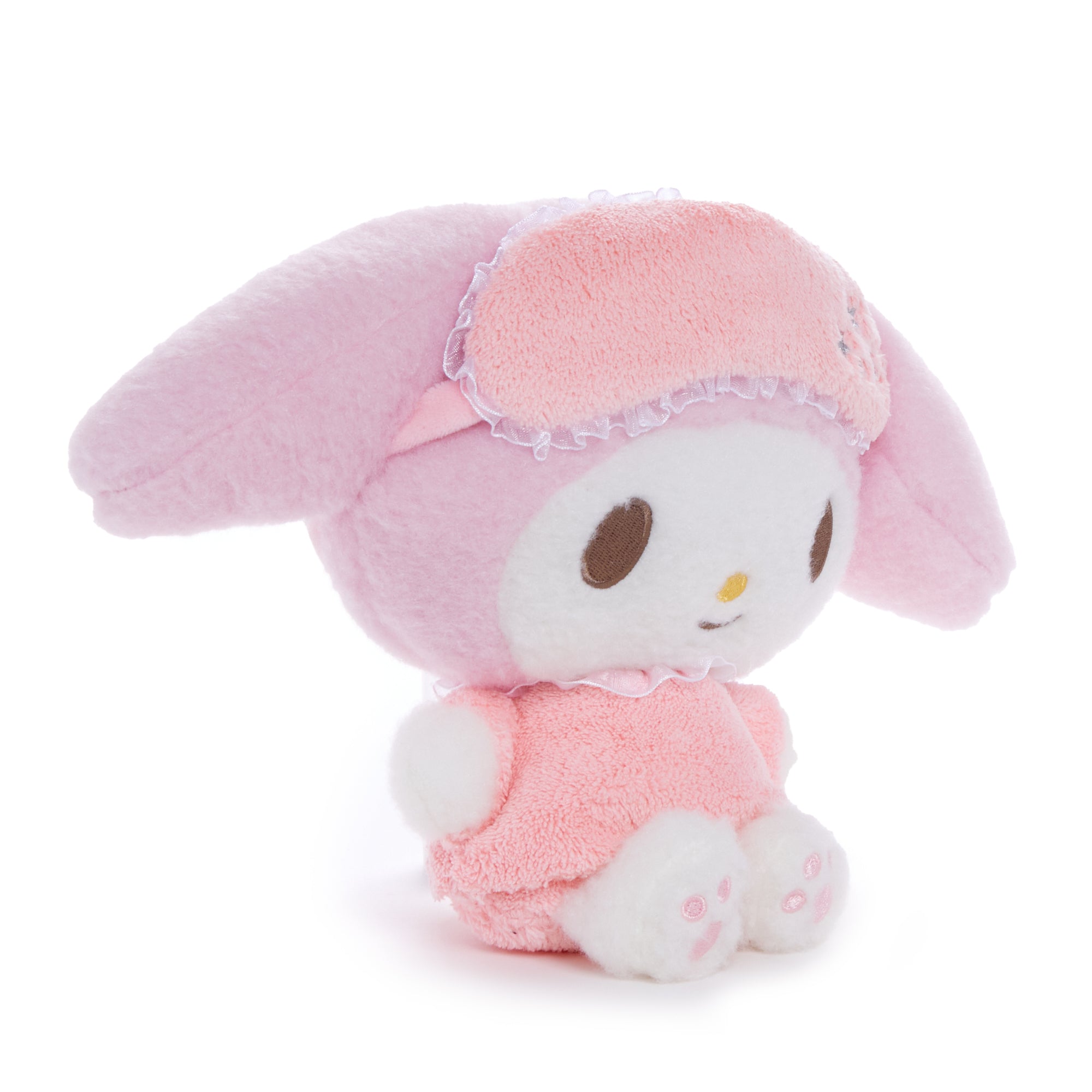 Front view of My Melody plush toy in pajamas on a bedside table