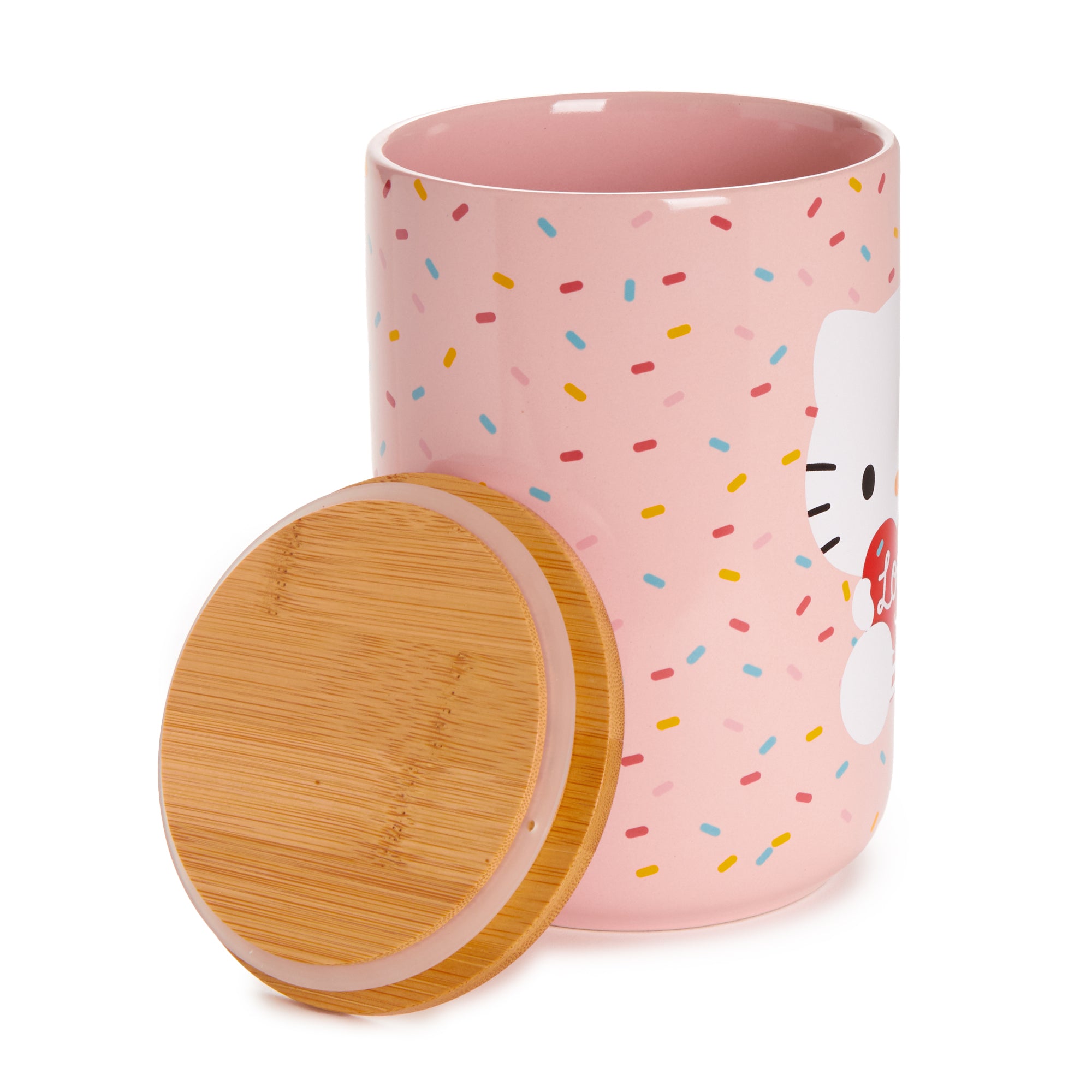 Side view of the heart-shaped ceramic cookie jar in a cozy kitchen setting