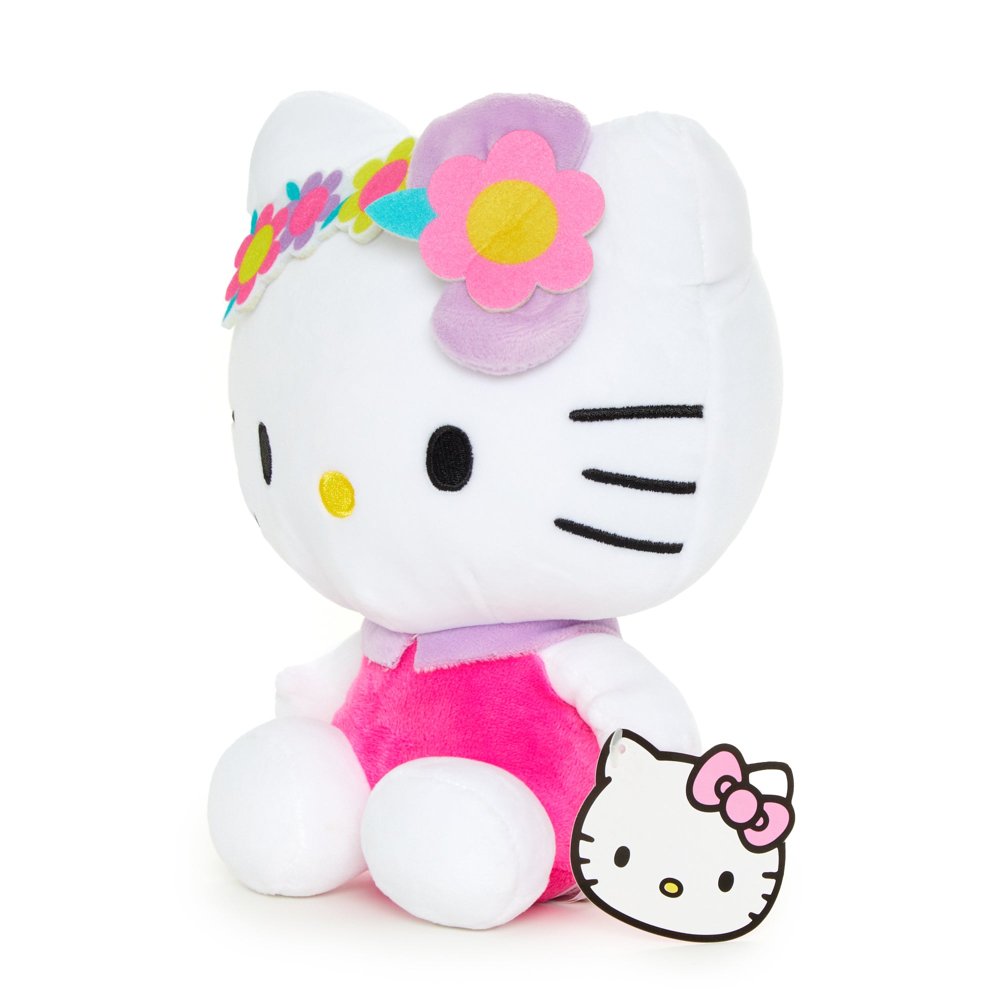 Pastel pink Hello Kitty plush, showcasing embroidered details.